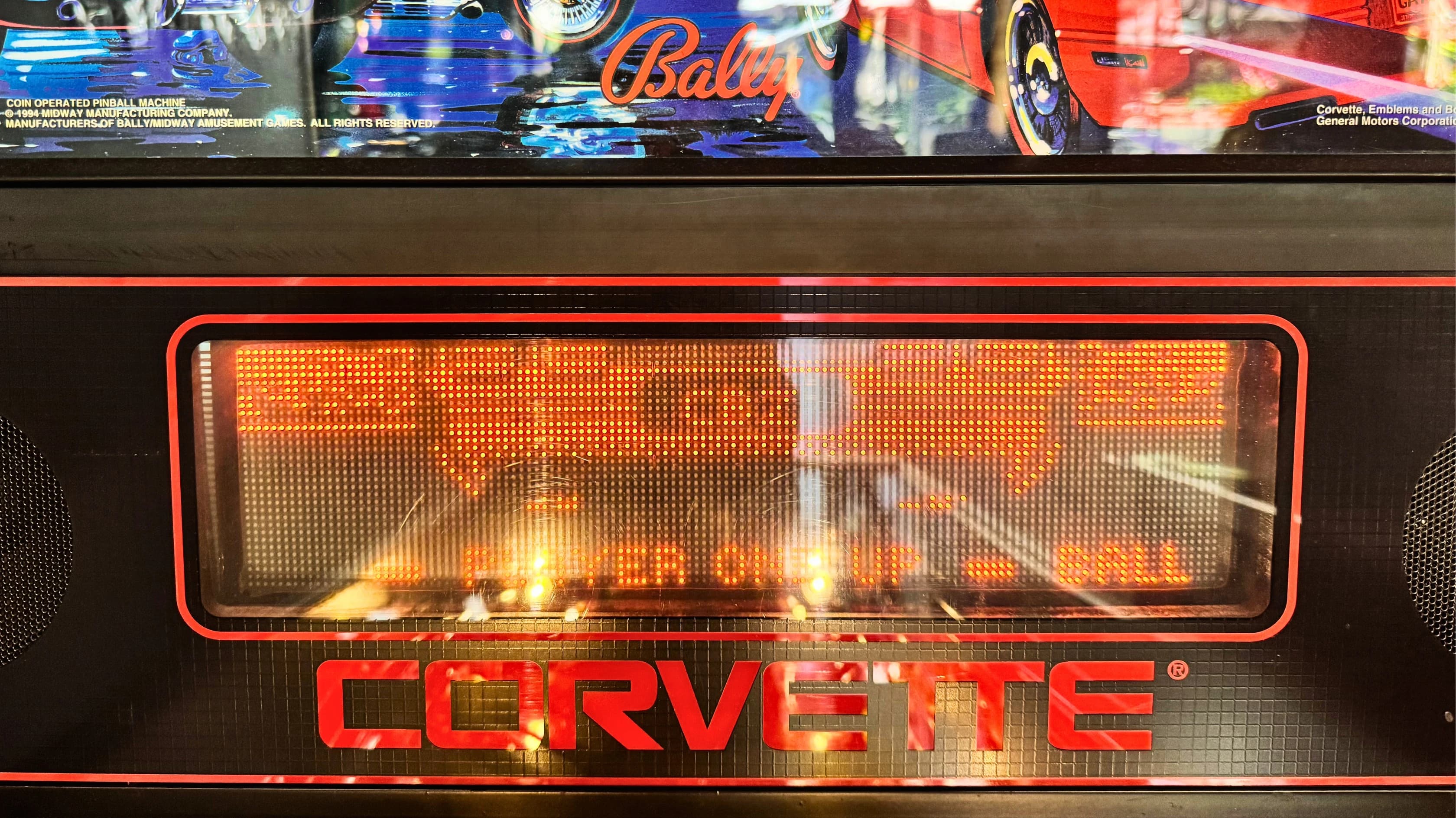 Corvette pinball machine display with glowing orange LED scoreboard