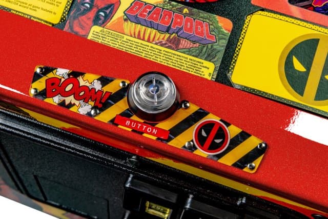 Deadpool-themed pinball machine with boom button and Deadpool logo