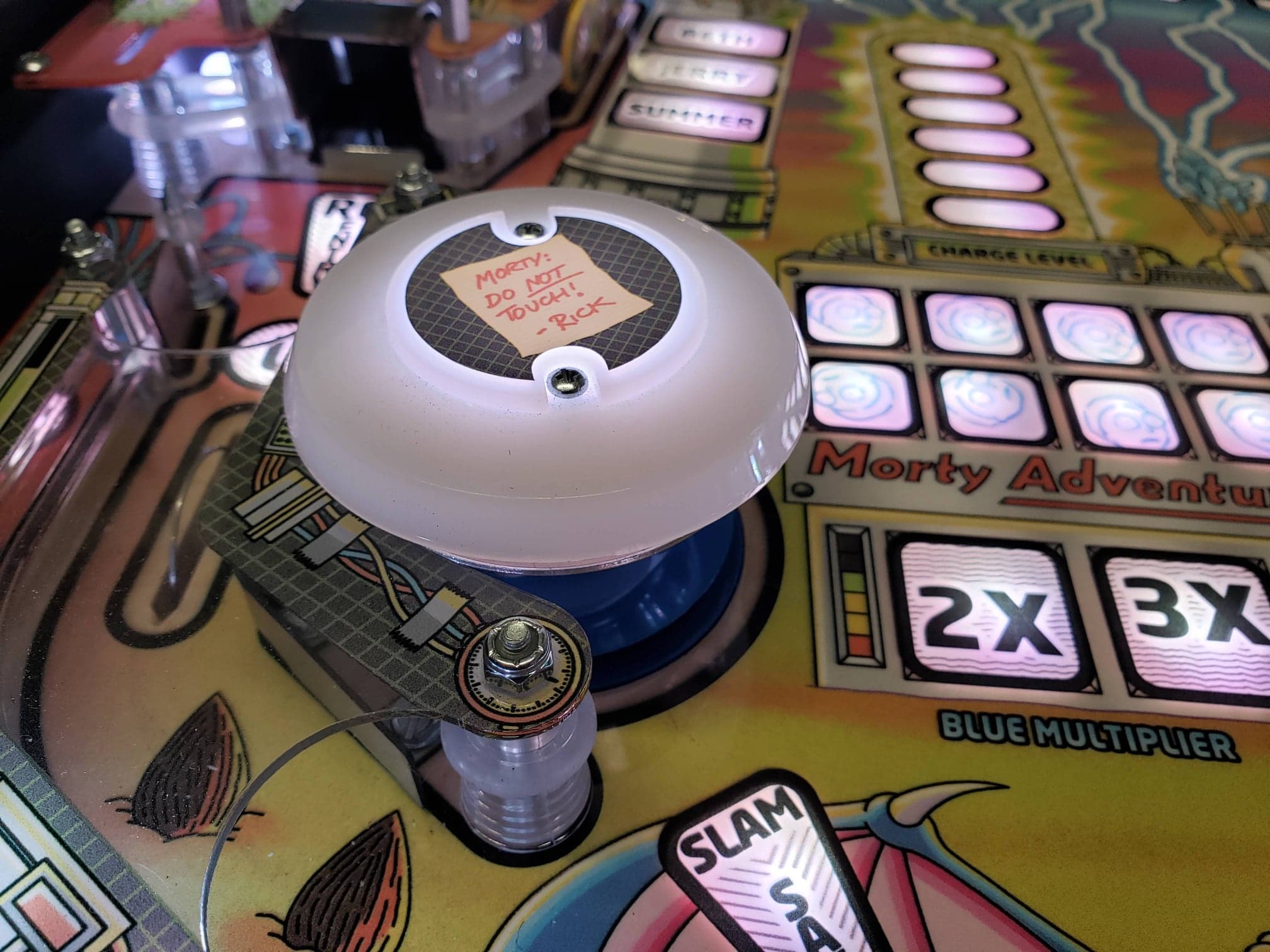 Morty Adventure pinball machine with white button and handwritten note