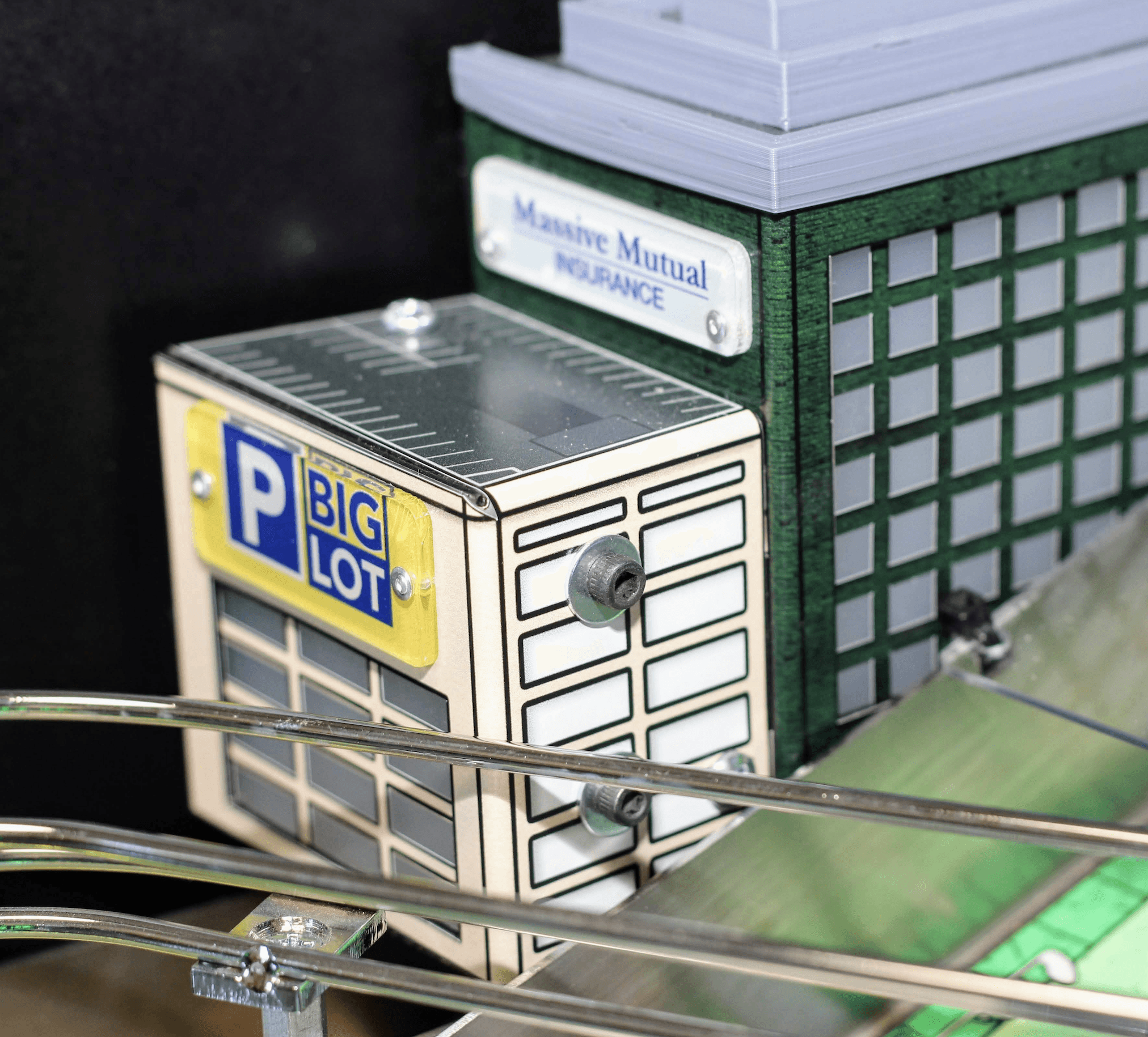 Model buildings of Big Lot and Maine Mutual with parking sign