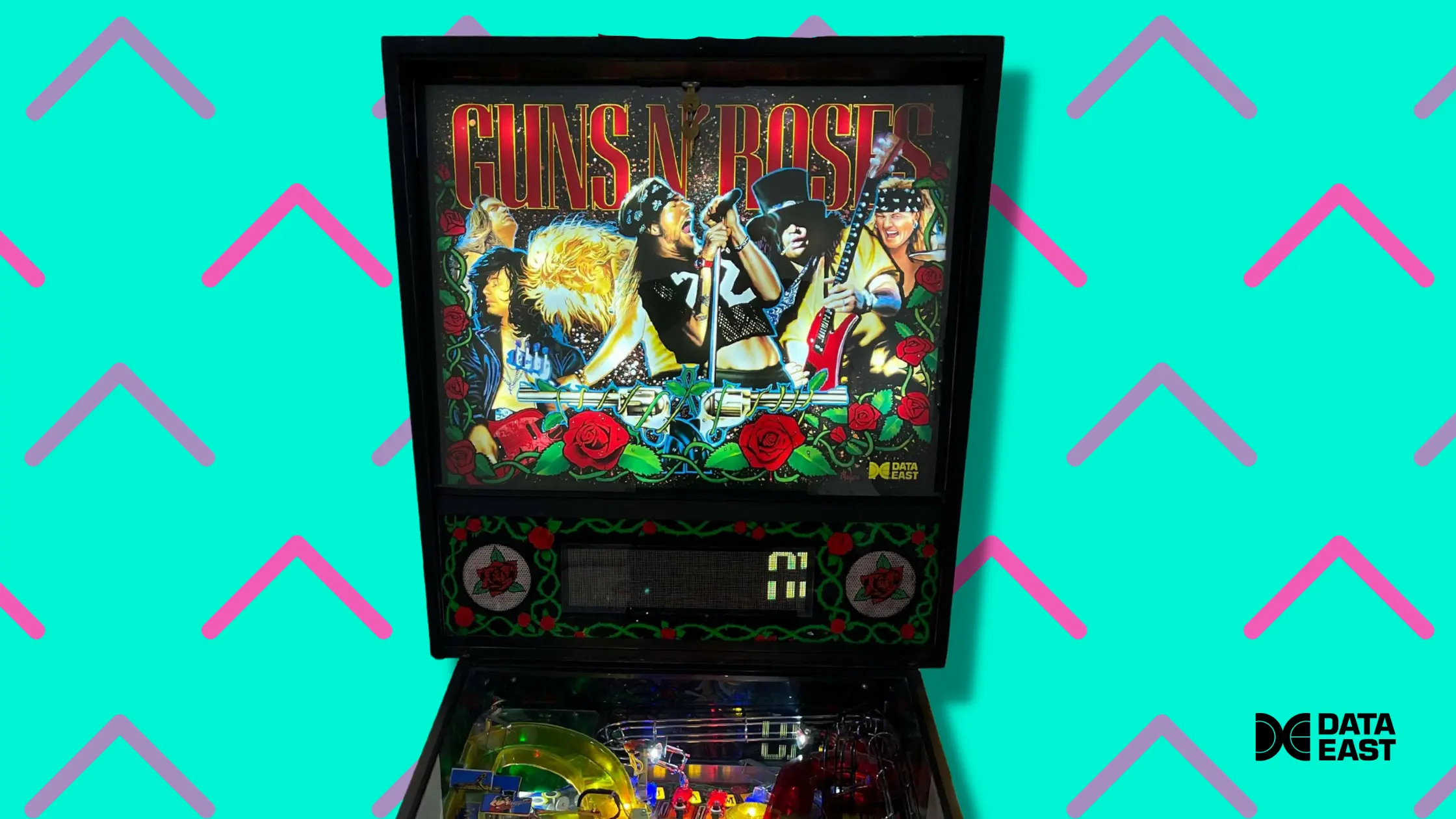 Guns N' Roses pinball machine with band members and roses