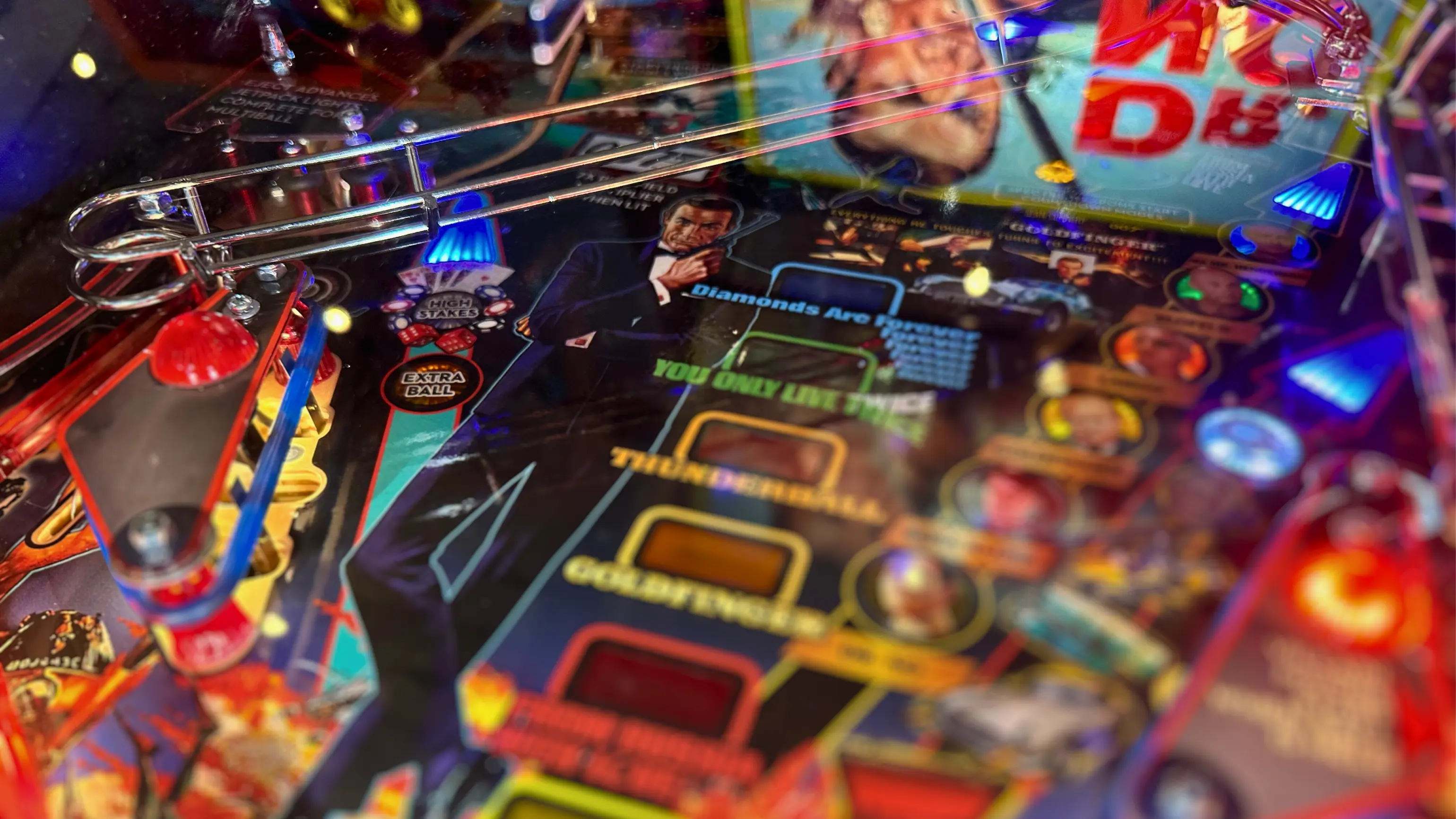 Colorful James Bond themed pinball machine with bright lights and details