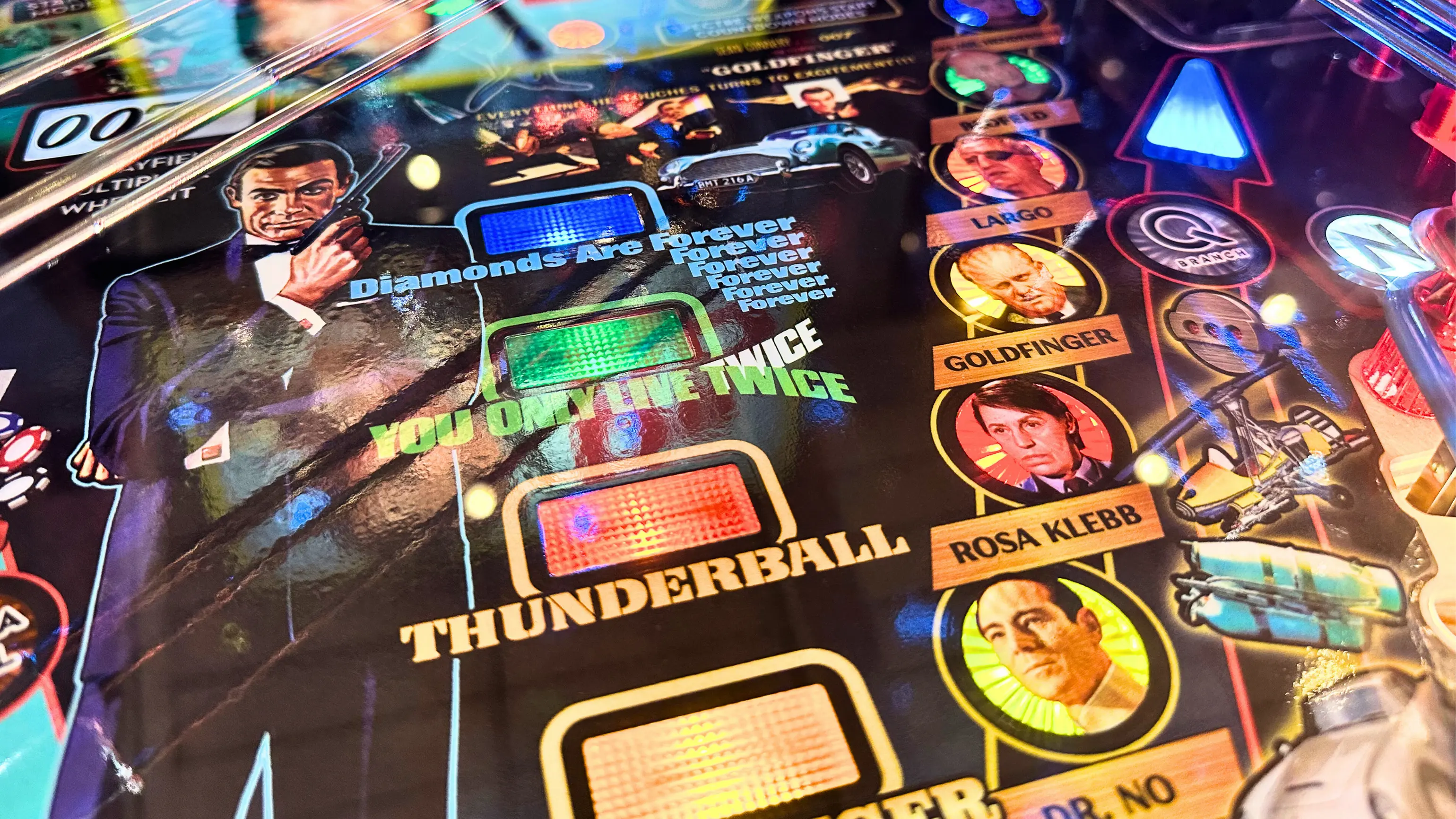 James Bond pinball machine with colorful movie scenes and characters