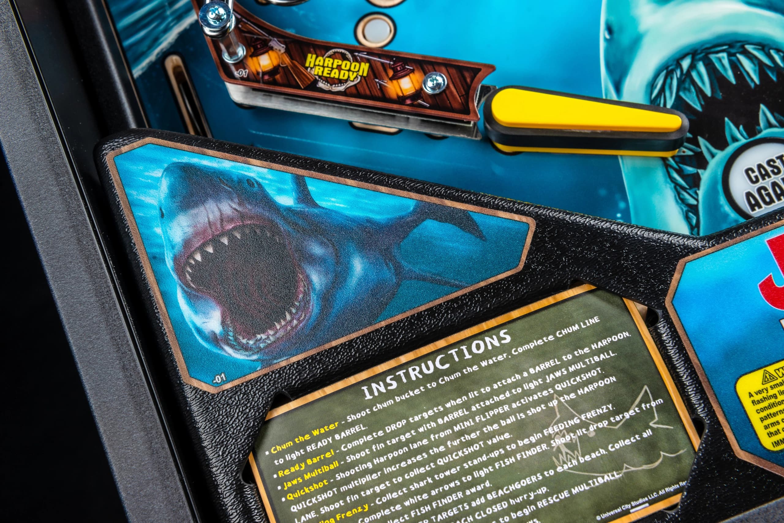 Jaws pinball machine detail with shark graphic and game instructions