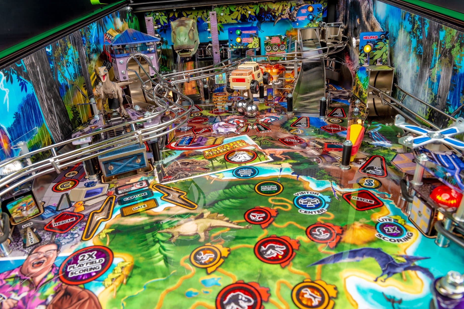Jurassic Park pinball machine with dinosaurs, vehicles, and colorful playfield details