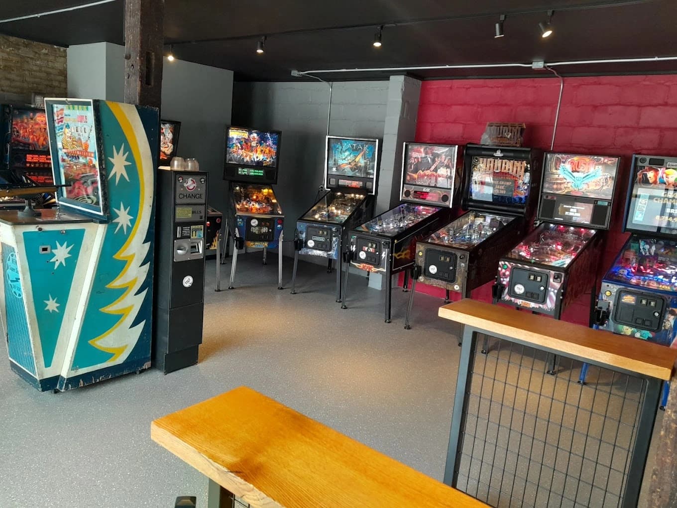 Vintage pinball machines lined up in a retro arcade game room