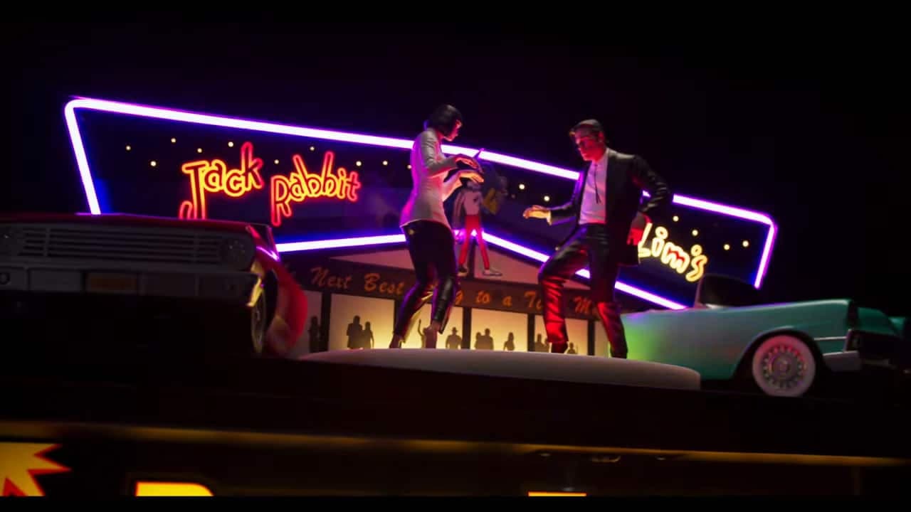 Neon-lit Jack Rabbit club stage with dancers and vintage car