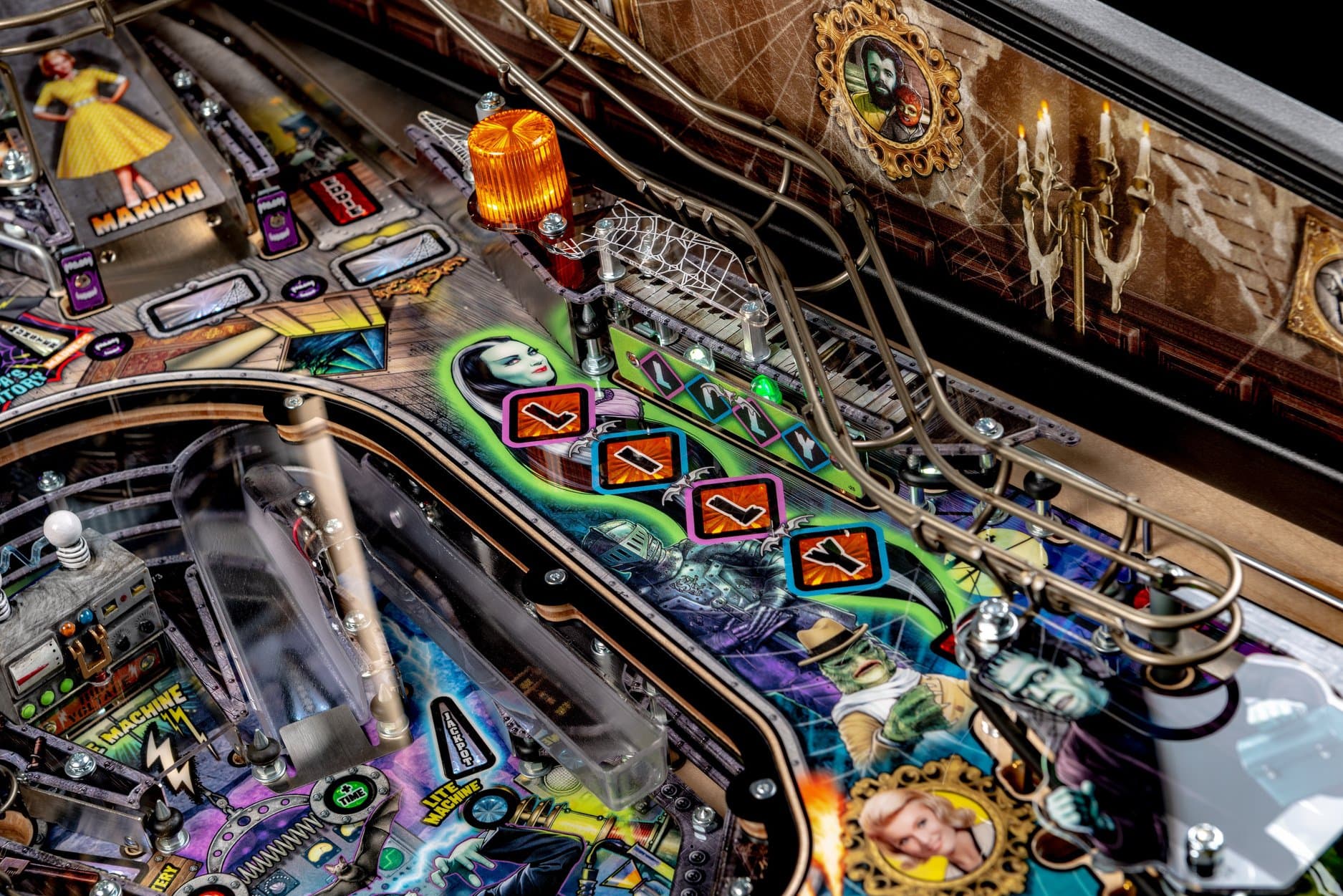 Detailed view of a colorful, gothic-themed pinball machine with intricate design
