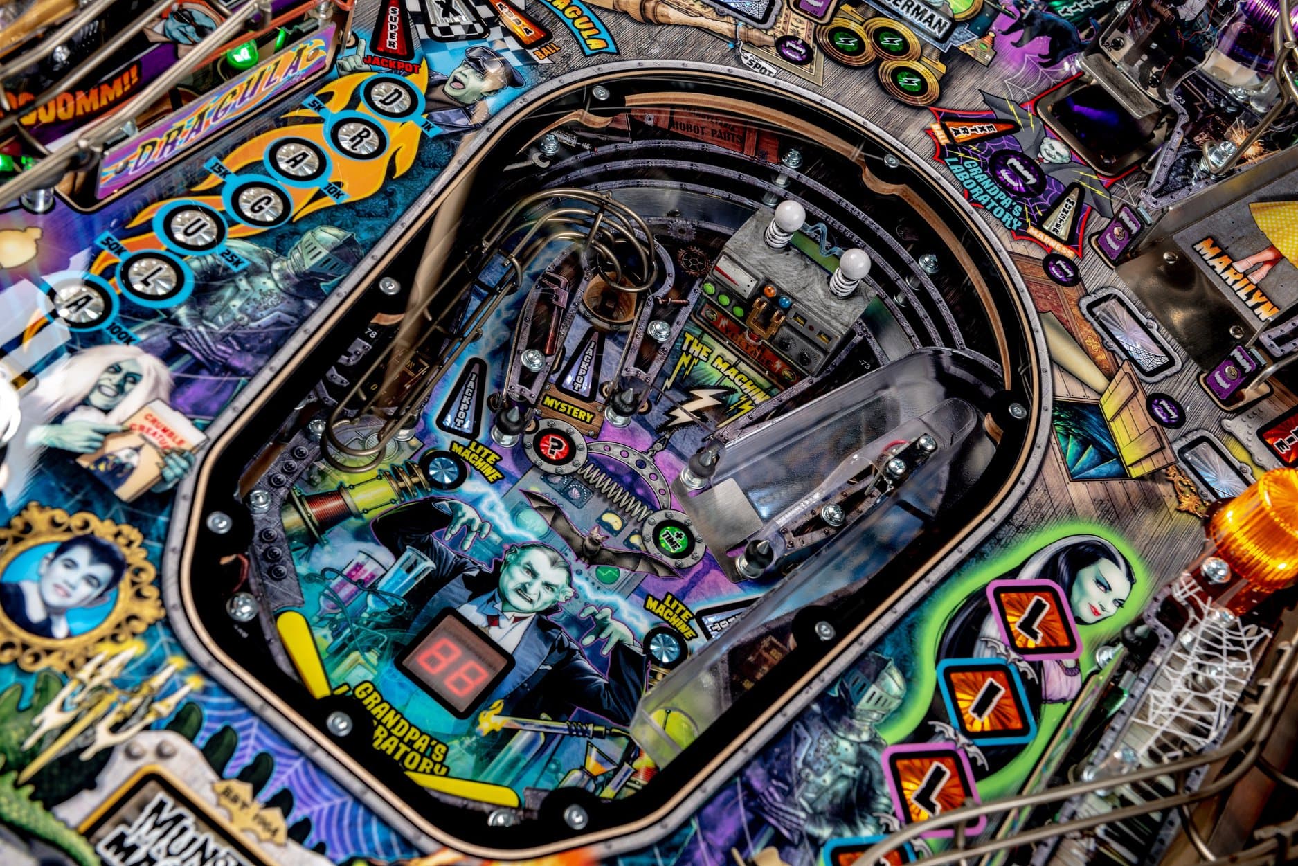 Colorful pinball machine with intricate design and multiple themed elements