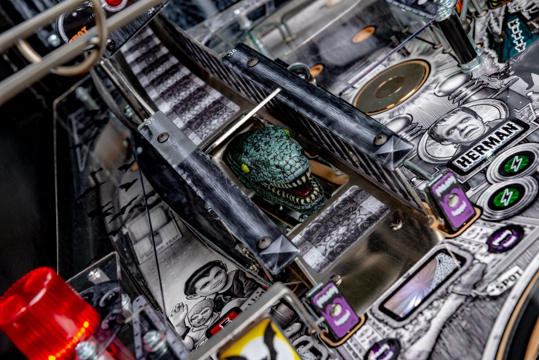 Detailed pinball machine with comic-style graphics and green monster head