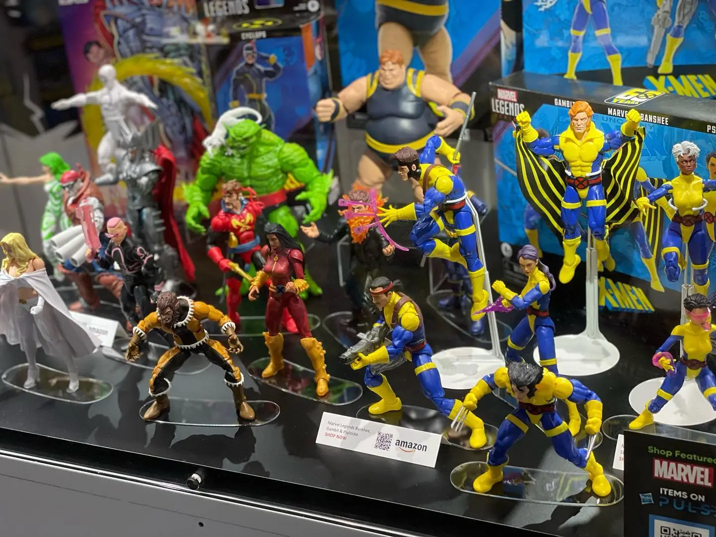 Marvel Legends action figures display with X-Men characters on stands