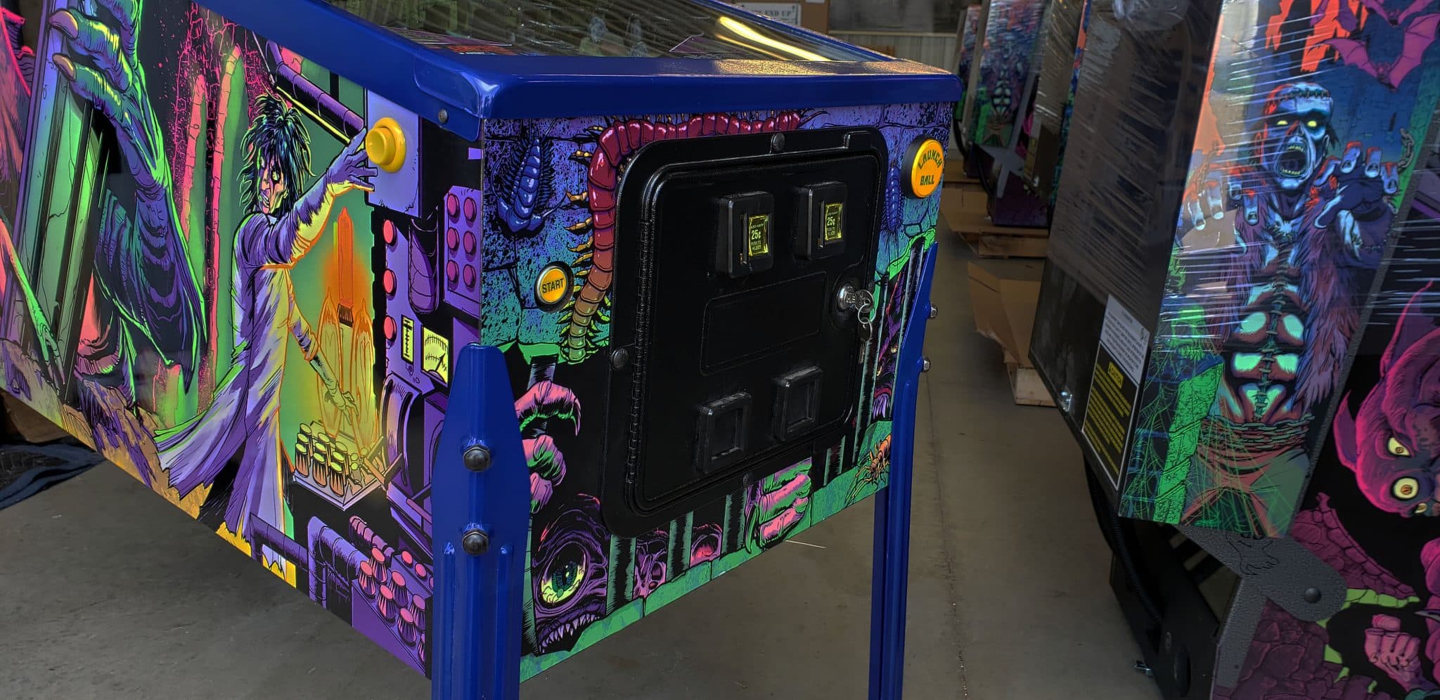 Colorful arcade machine with vibrant psychedelic monster artwork