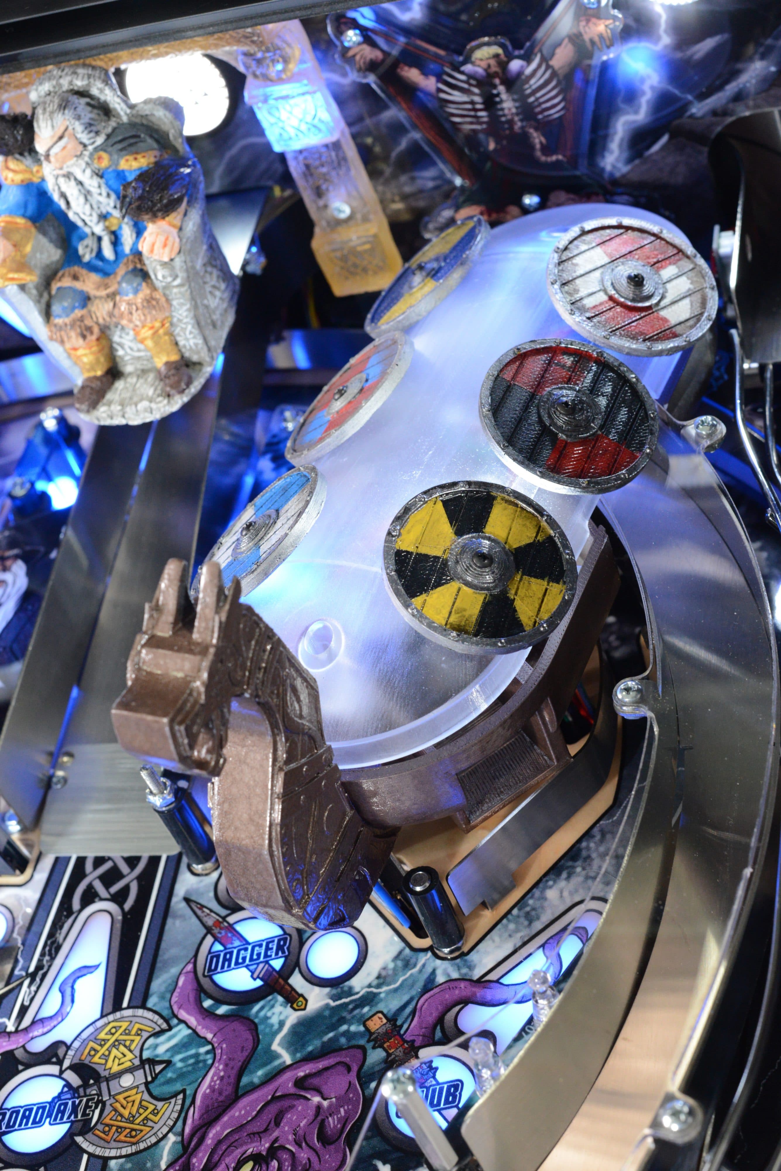 Pinball machine detail with radioactive symbol and intricate mechanical components
