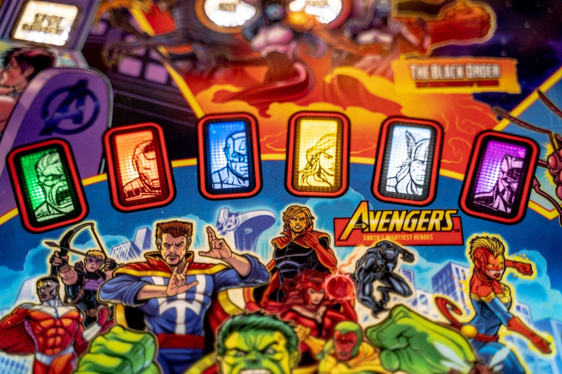 Colorful Avengers comic art with superhero characters and stylized icons