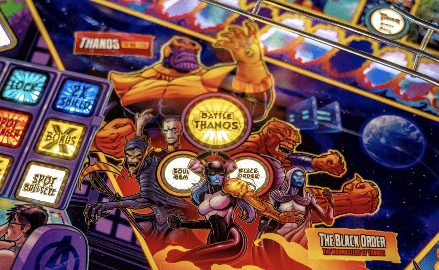Thanos and Black Order characters on a colorful cosmic pinball machine