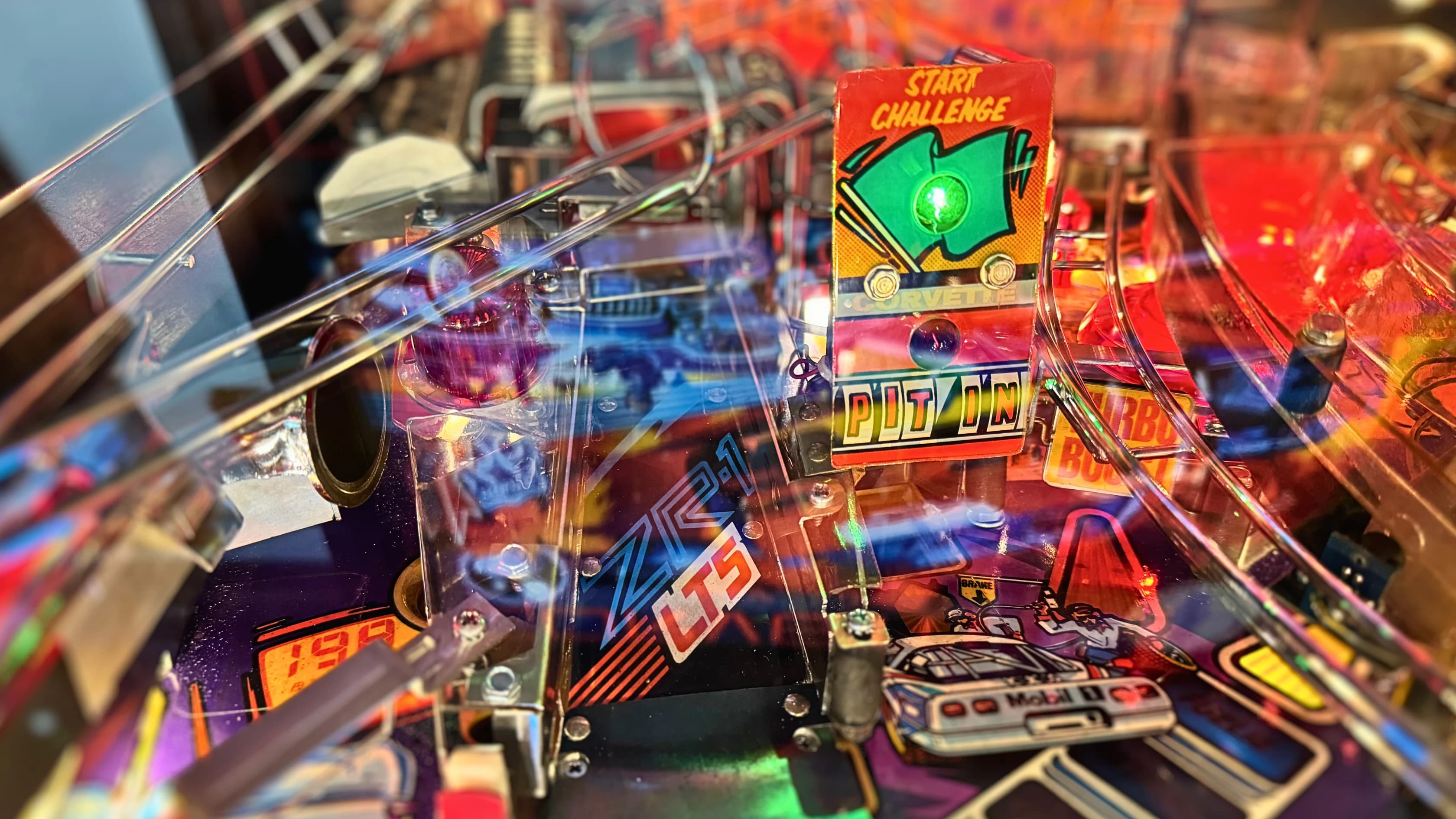 Colorful pinball machine with glowing lights and vibrant retro design