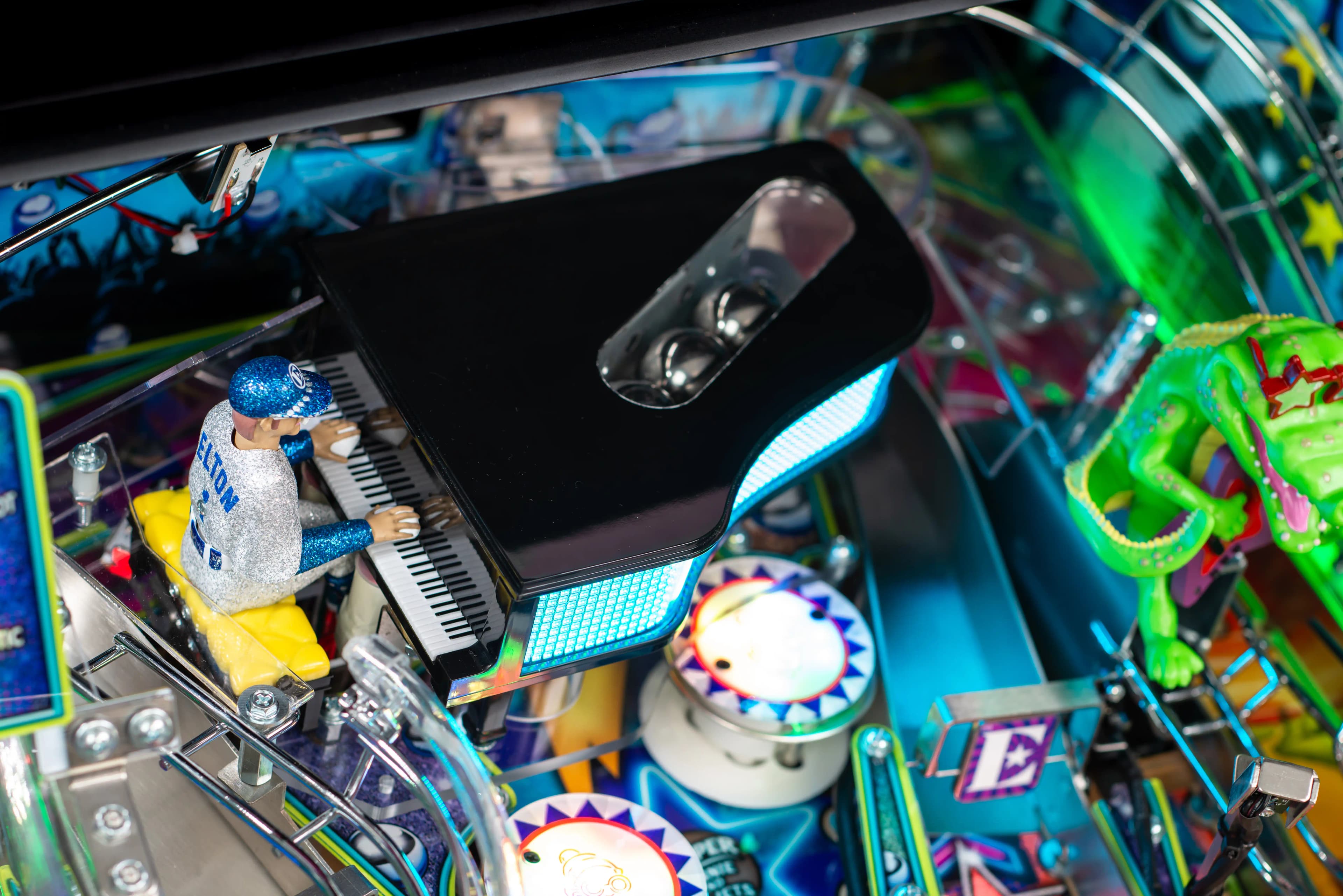 Colorful pinball machine with intricate details and glowing electronic components