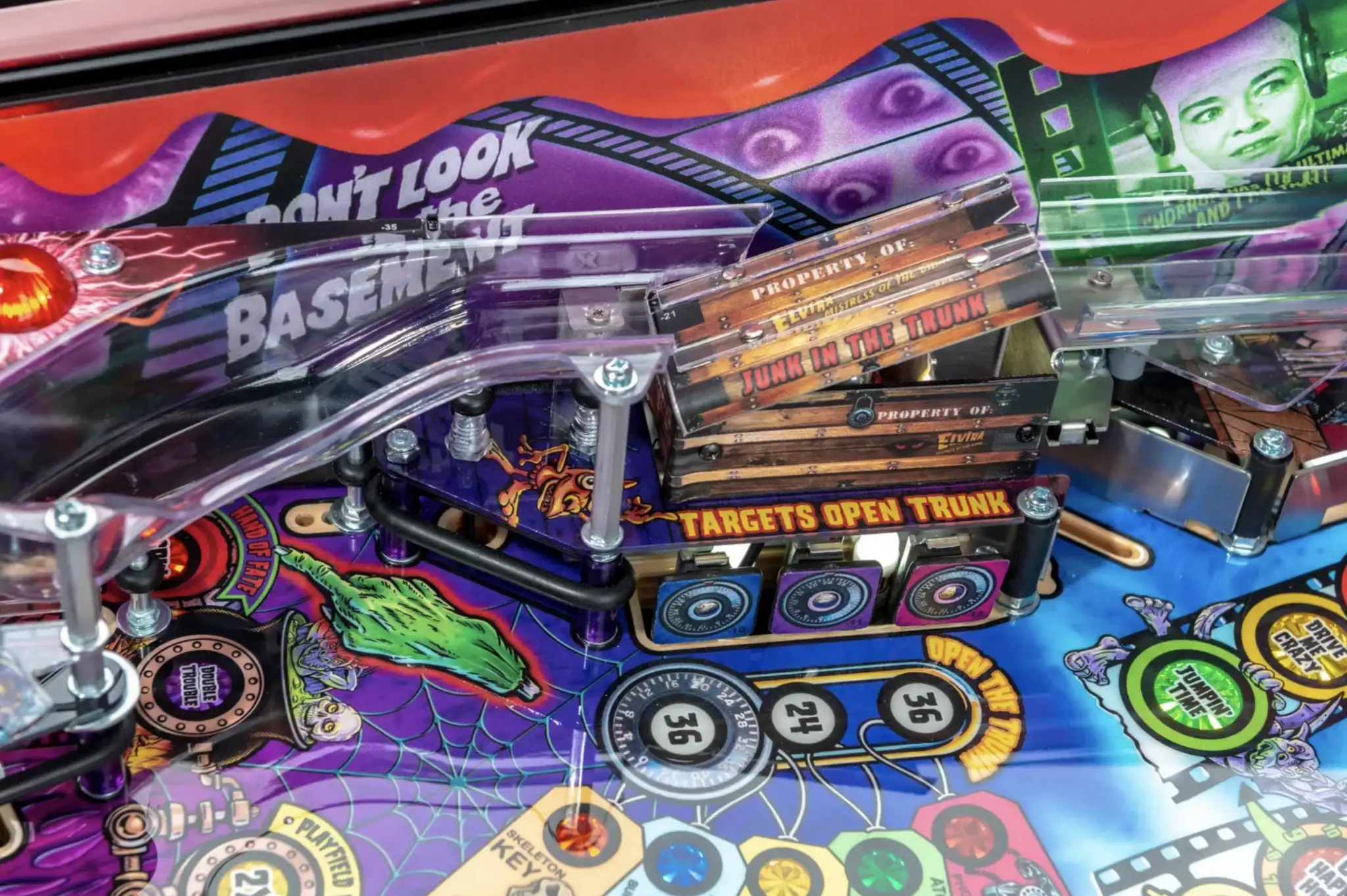 Colorful pinball machine with targets, web design, and "Basement" text