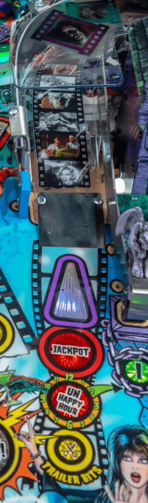 Pinball machine backglass with film strips, jackpot, and unhappy hour