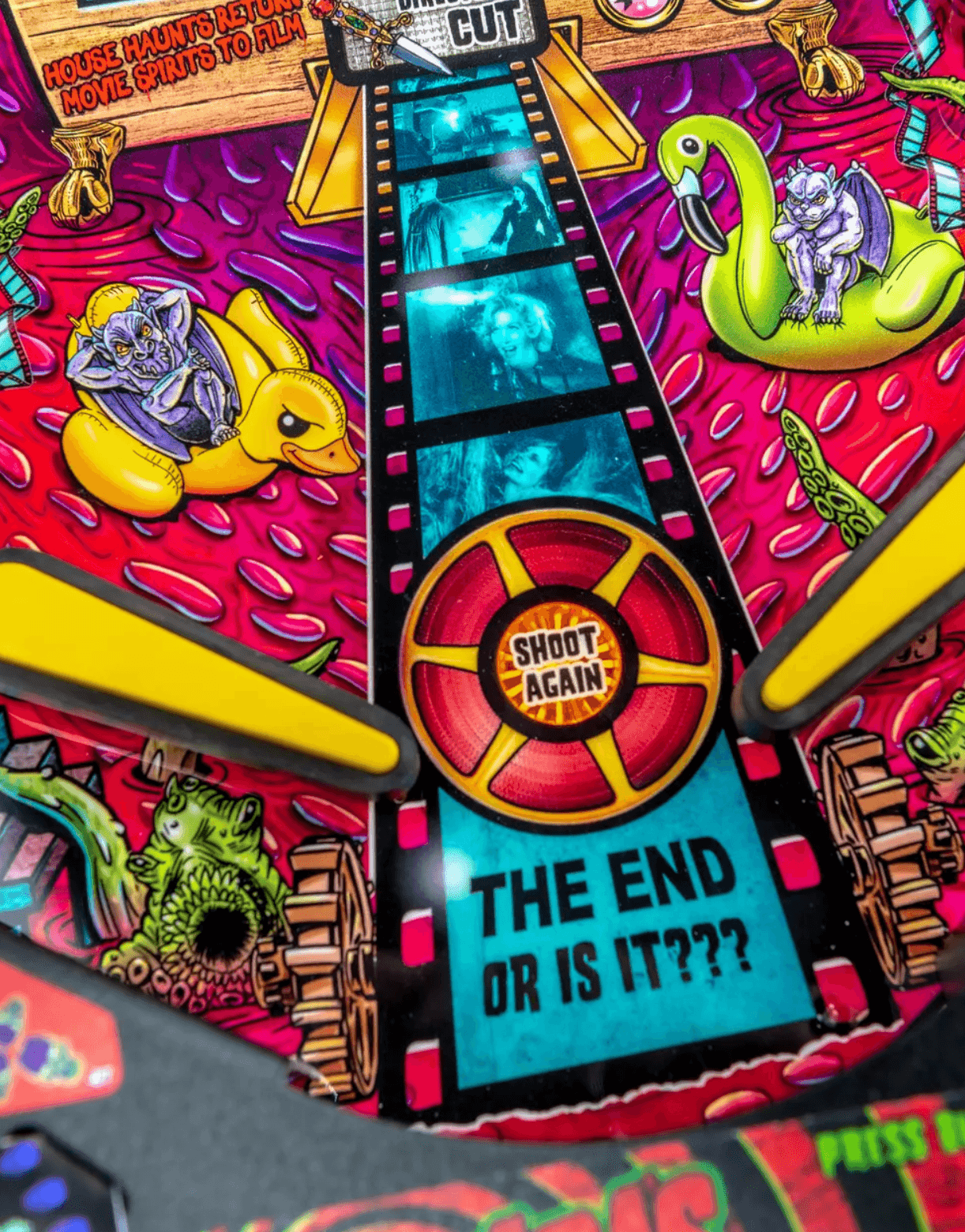 Colorful movie-themed pinball machine with film strip and monster characters