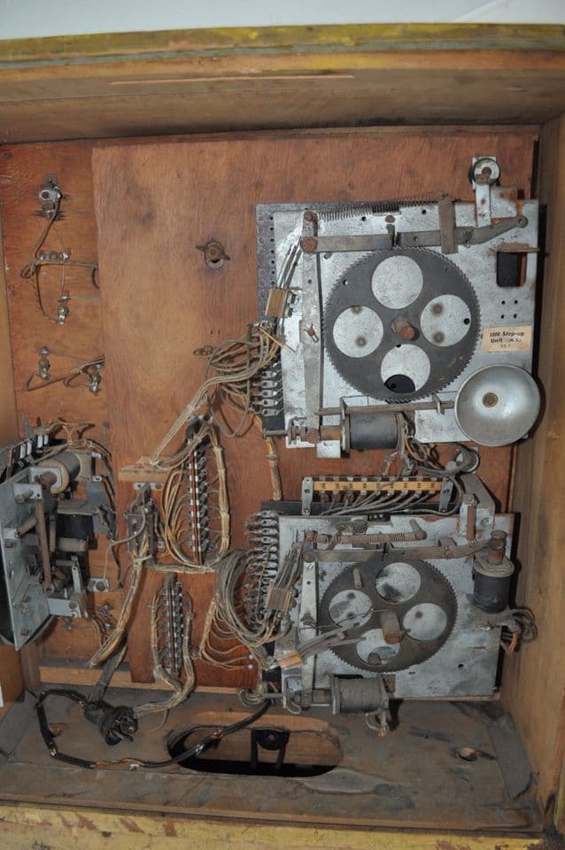 Vintage mechanical device with gears, wires, and complex machinery