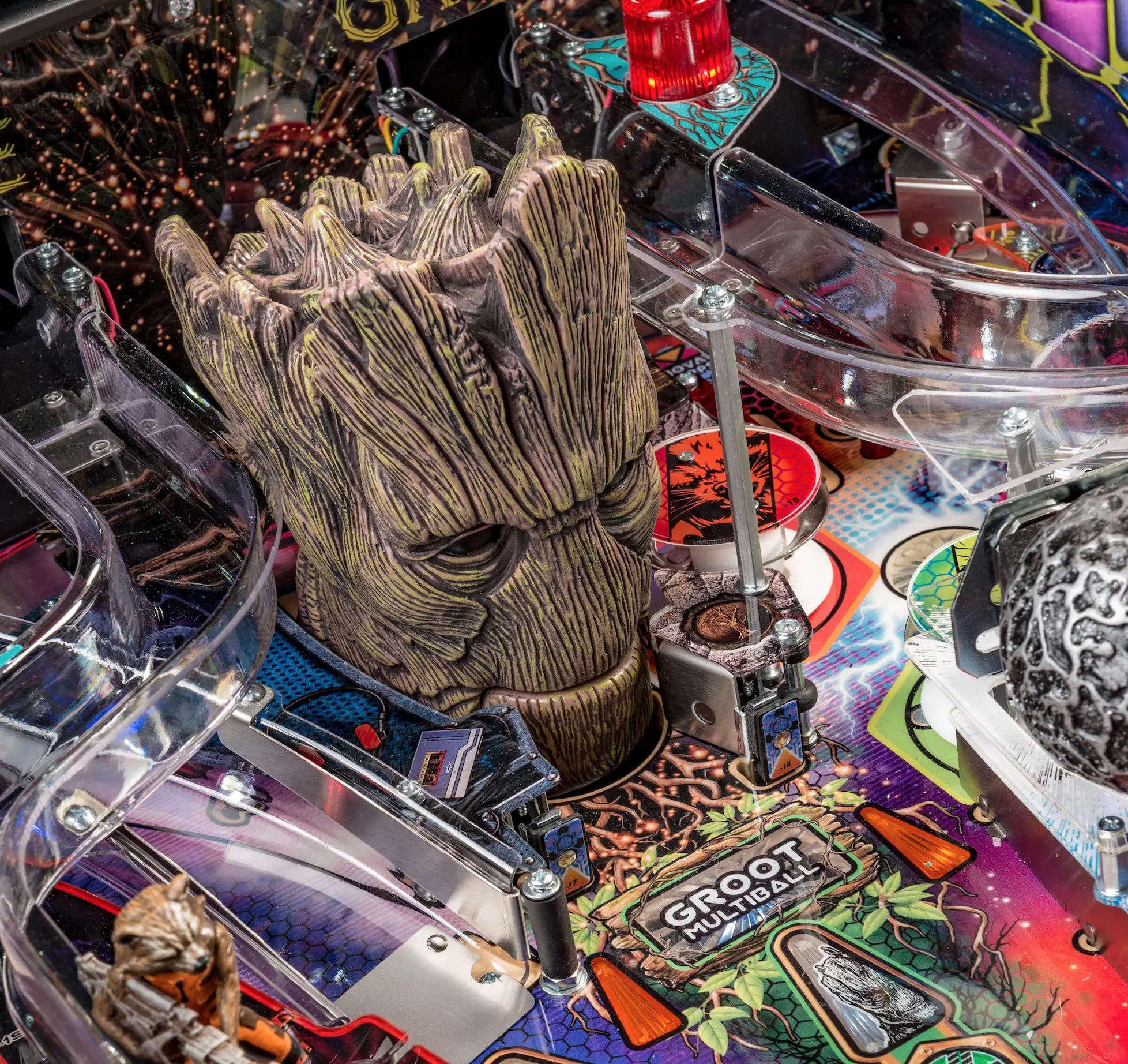 Groot-themed pinball machine with detailed wooden character figure