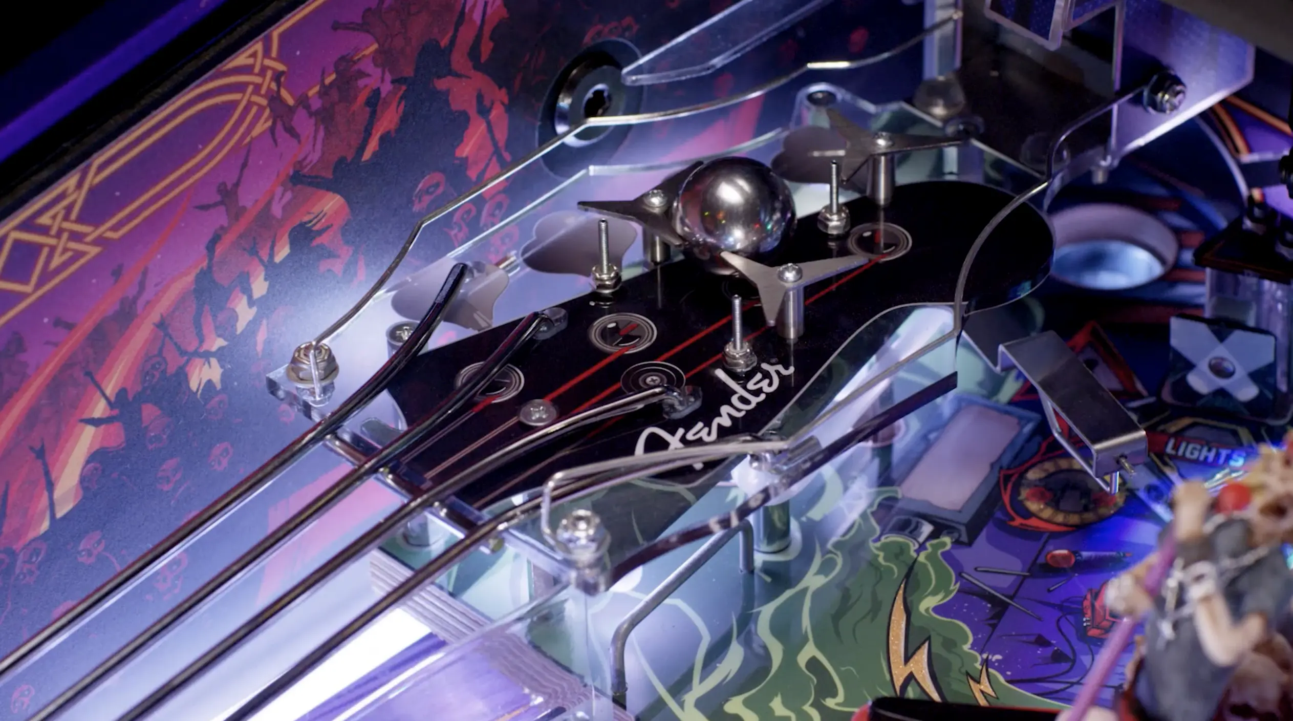 Colorful pinball machine with intricate metallic components and vibrant artwork