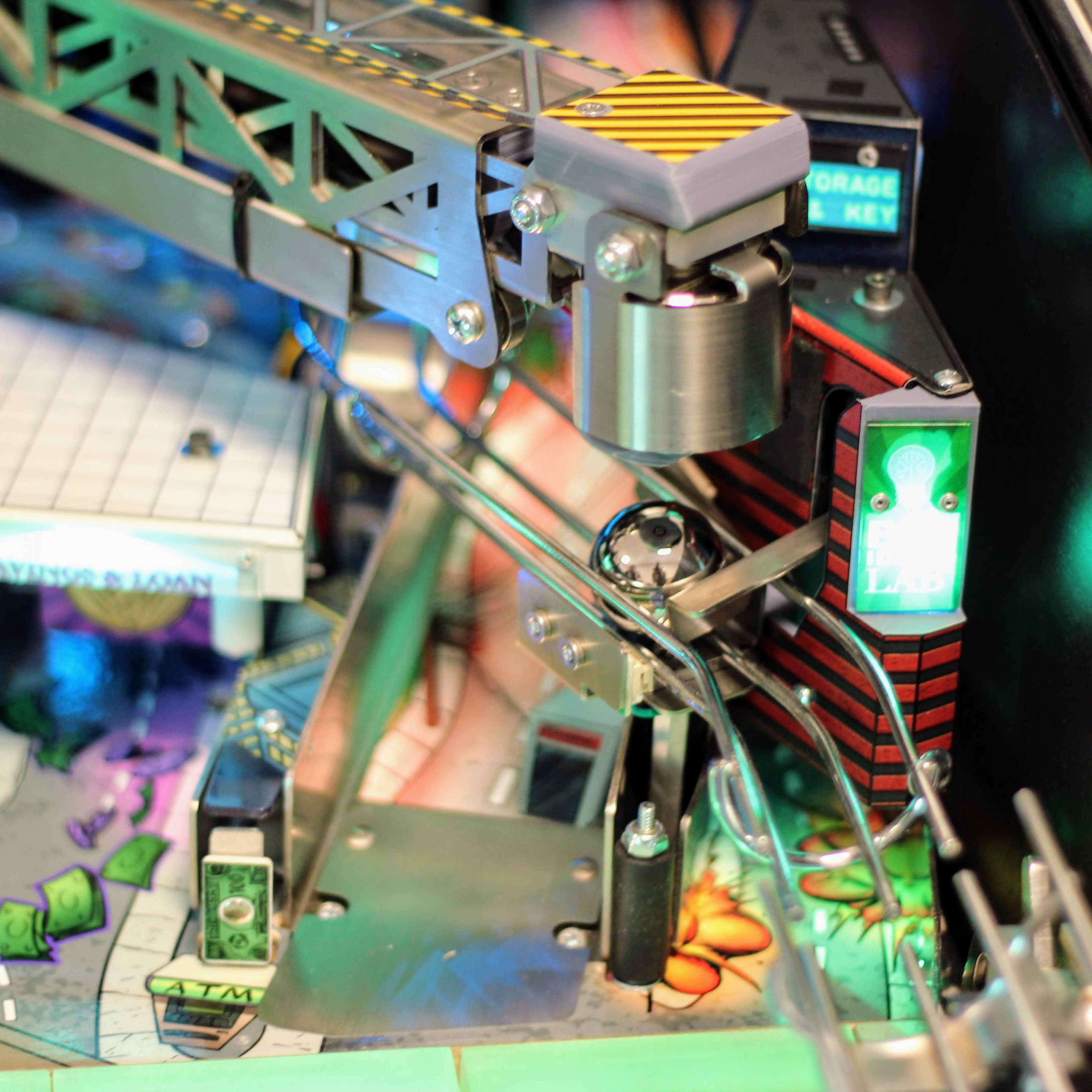 Complex robotic arm mechanism with green lights on detailed technical equipment