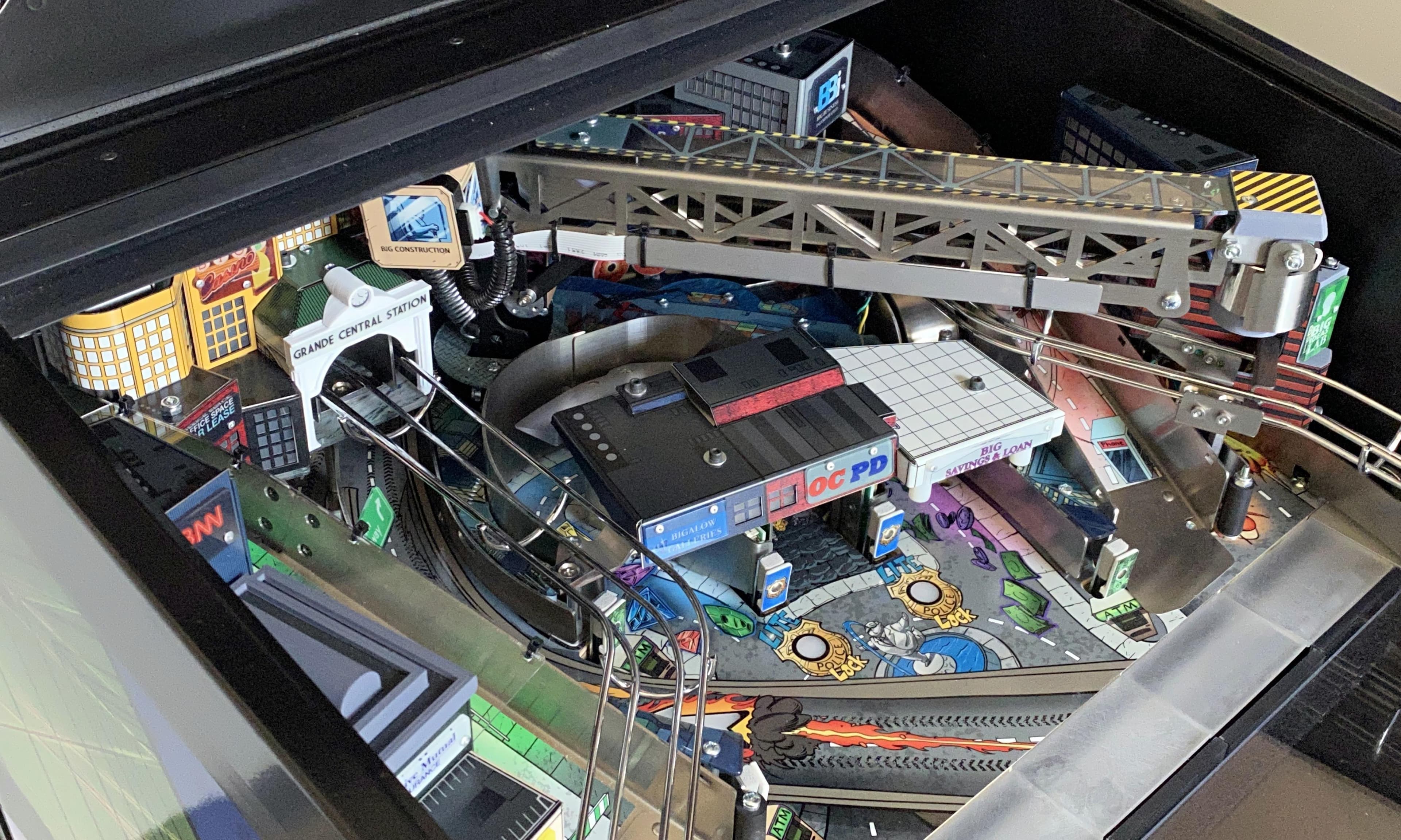 Detailed model train layout with city buildings, tracks, and infrastructure