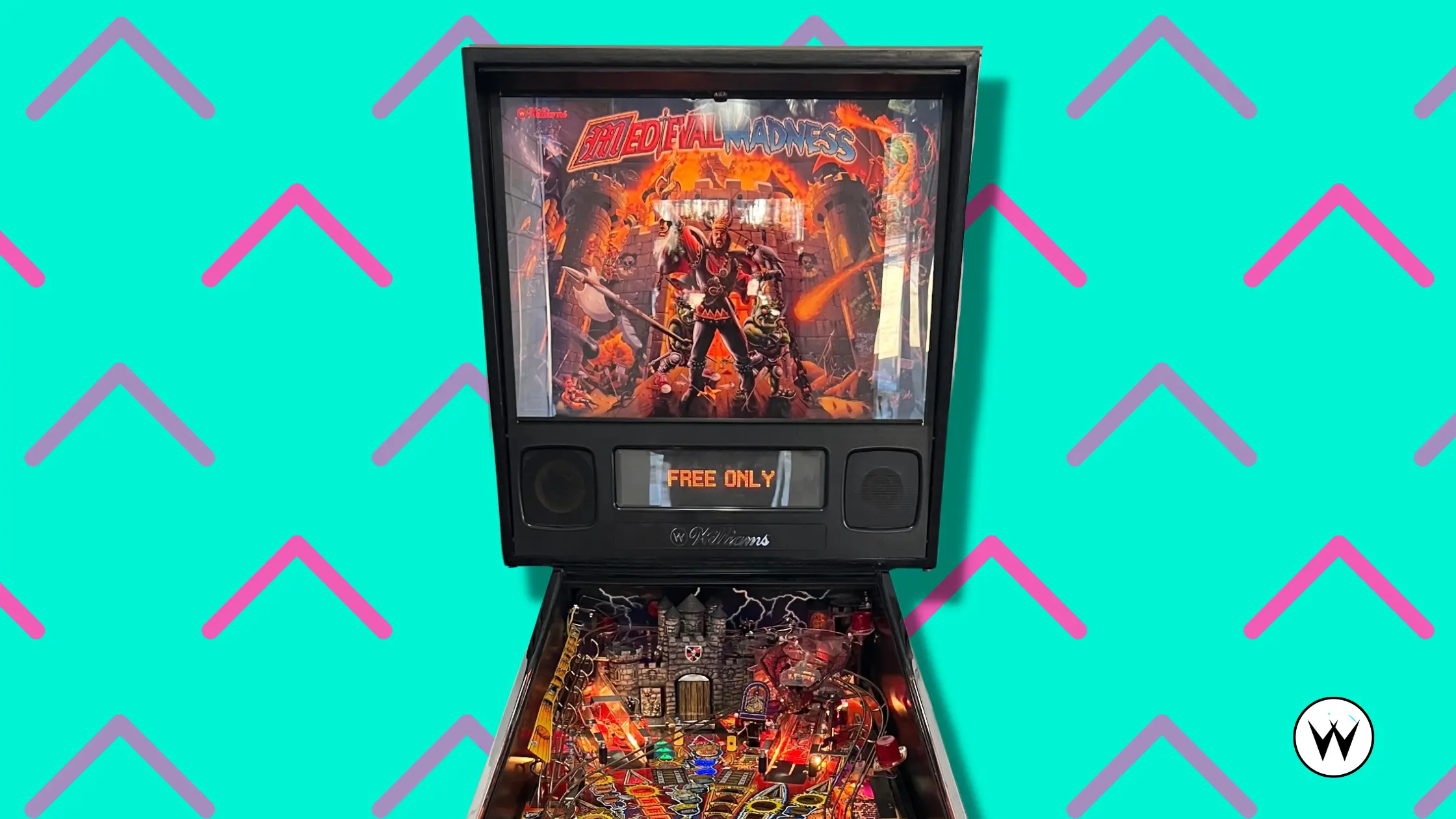 Medieval Madness pinball machine with fiery medieval battle backglass