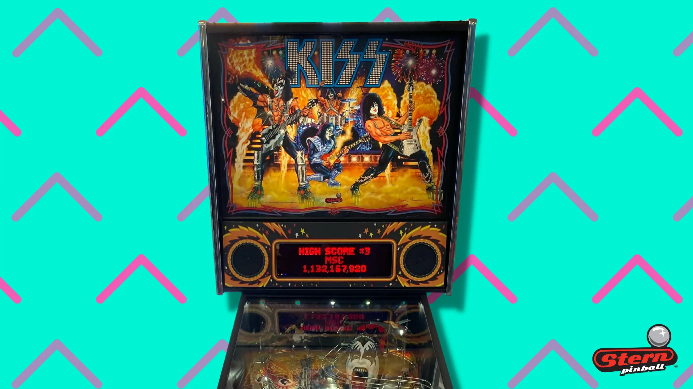 KISS pinball machine with band members on colorful background