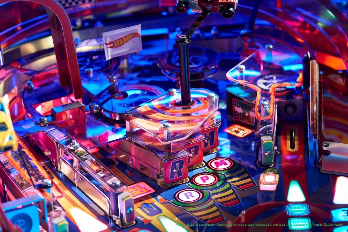 Colorful Hot Wheels pinball machine with vibrant blue and red lights