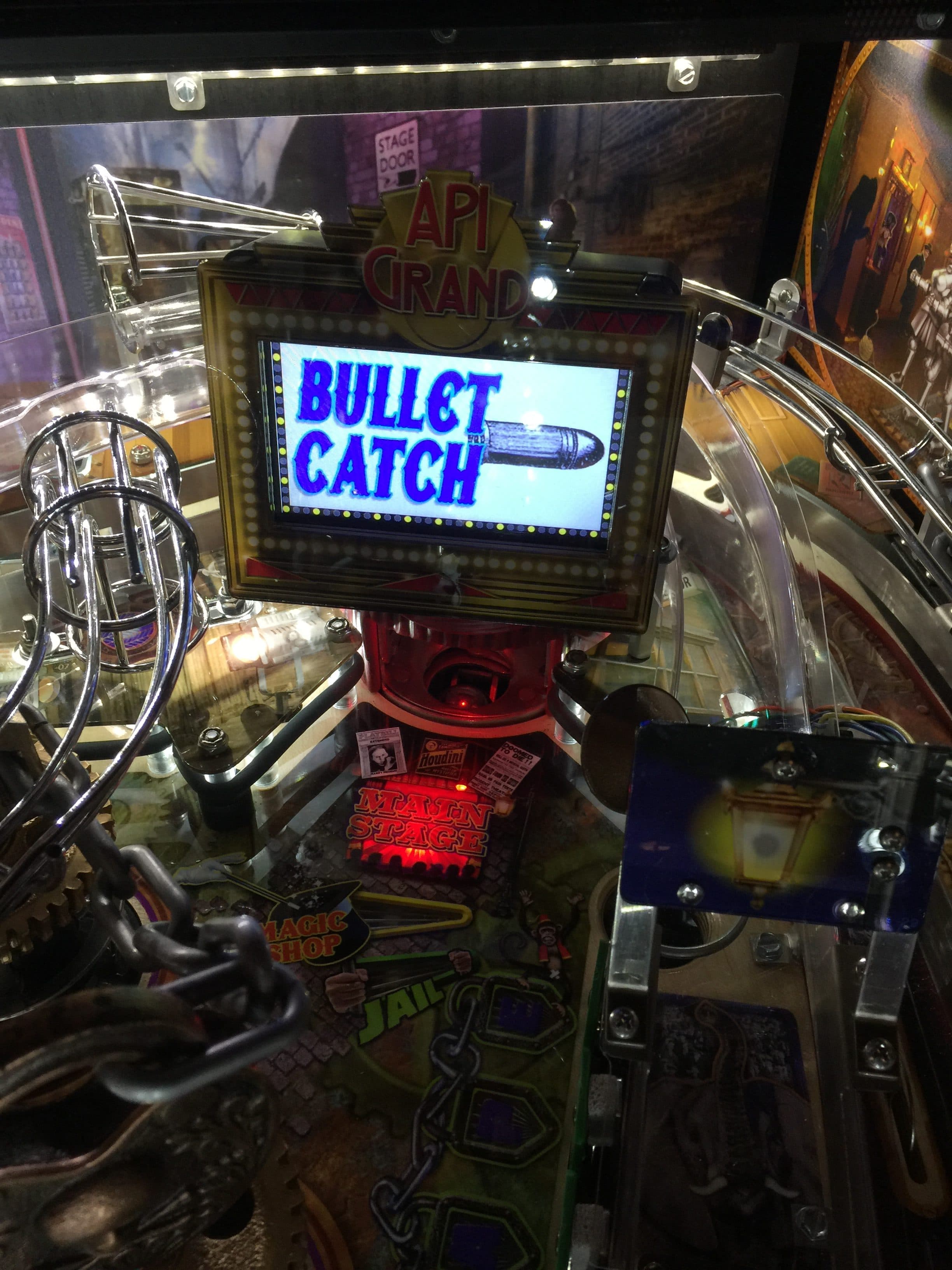 Bullet Catch game screen on pinball machine with Api Grand logo