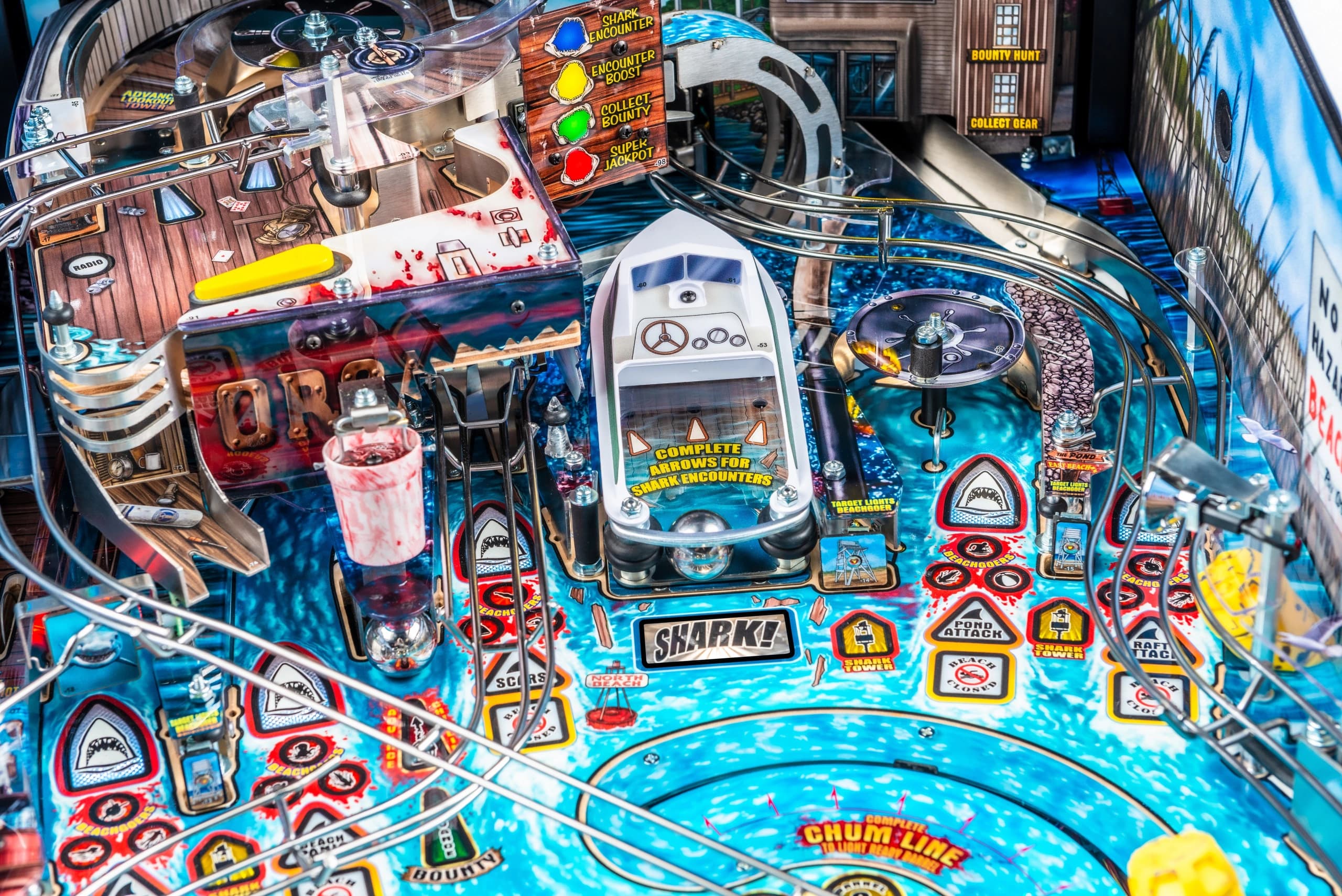 Detailed shark-themed pinball machine with blue background and intricate elements