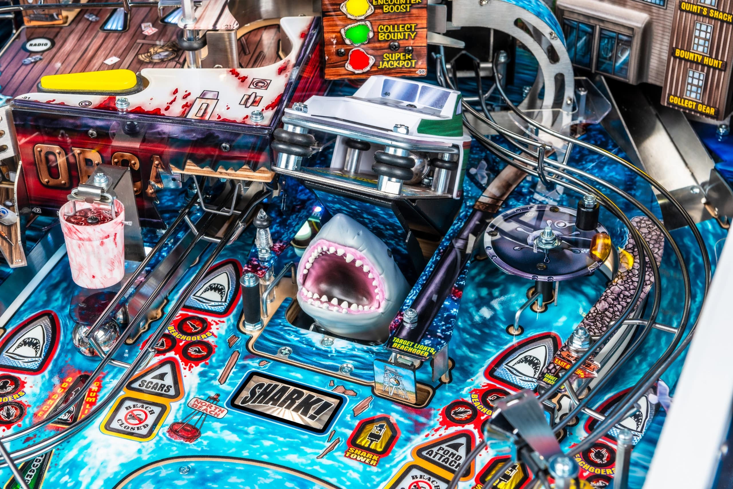 Detailed shark-themed pinball machine with blue ocean background and mechanical elements