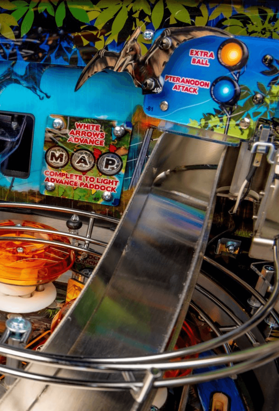 Jurassic Park pinball machine with pteranodon, white arrows, and extra ball