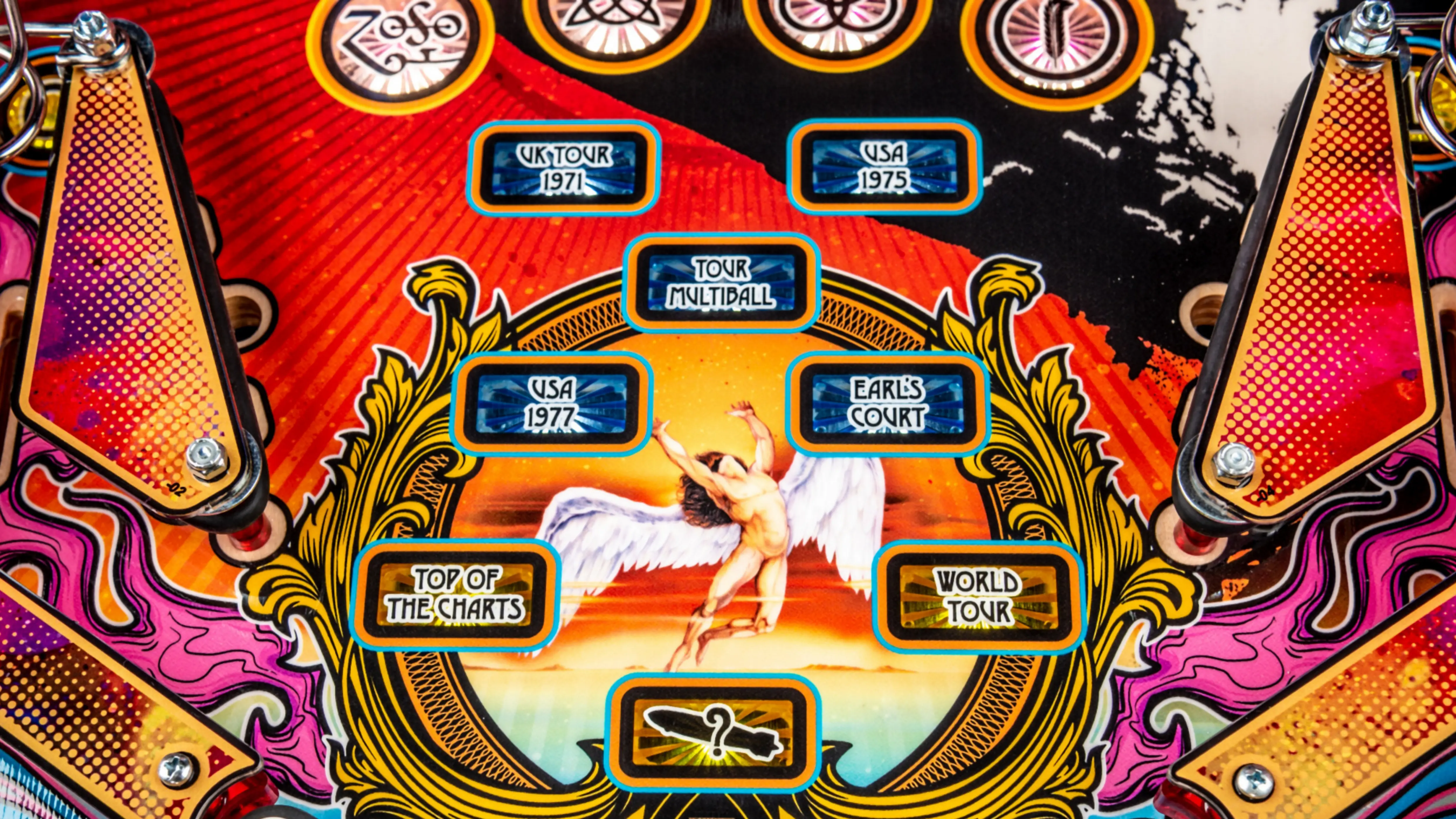 Colorful pinball machine backglass with winged angel and tour locations