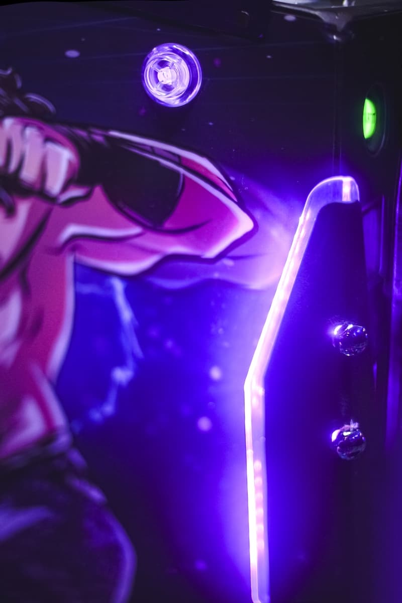 Purple and blue neon lights illuminating a sleek metallic surface