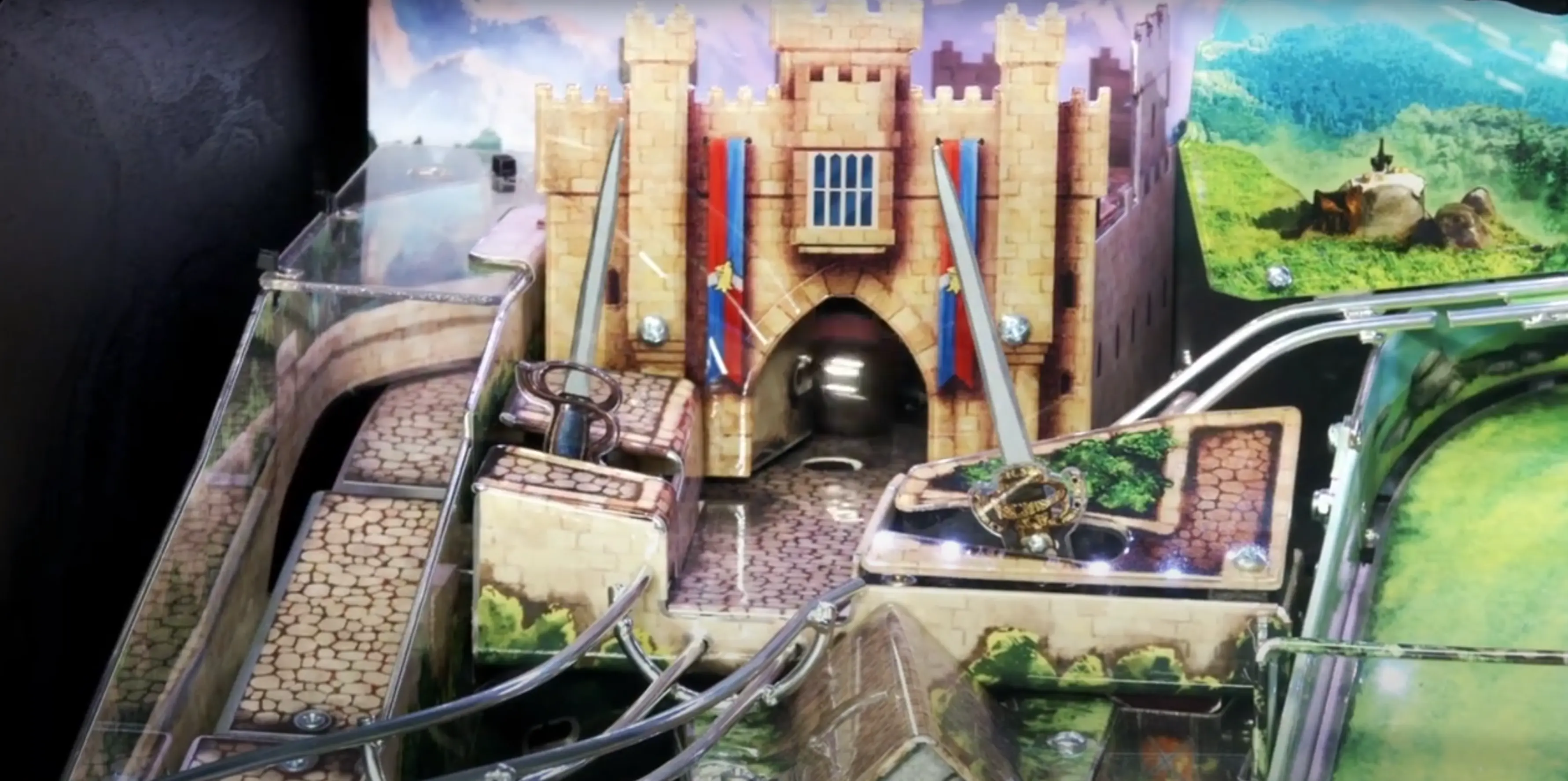 Marble run with medieval castle, winding tracks, and scenic landscape