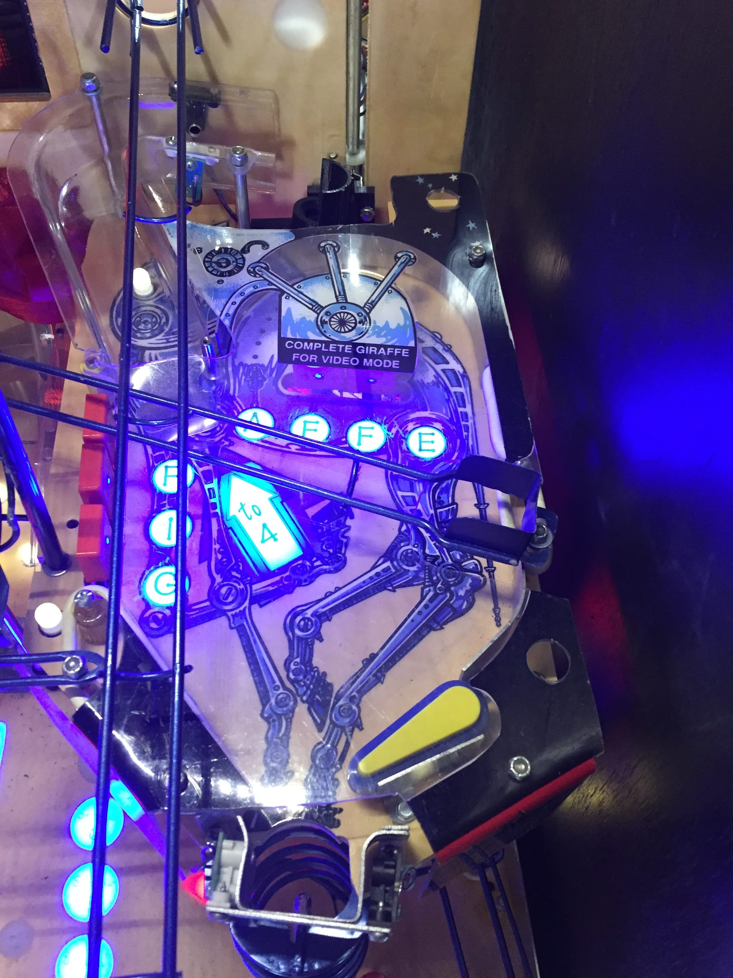 Robotic device with blue and purple lighting, showing giraffe video mode