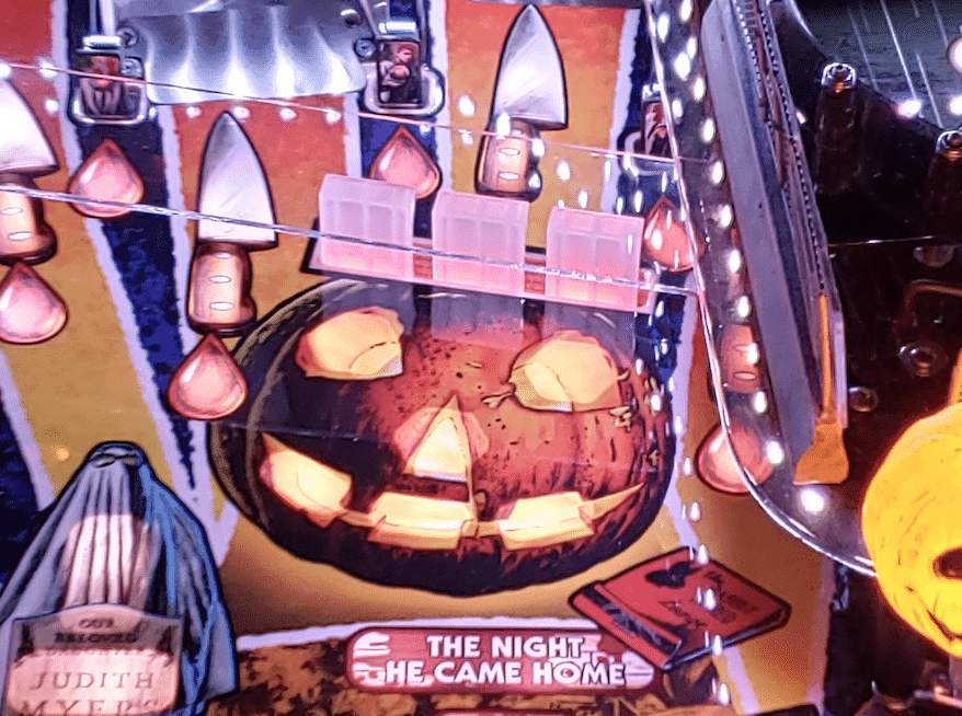 Glowing Halloween pumpkin with carved face on "The Night She Came Home" poster