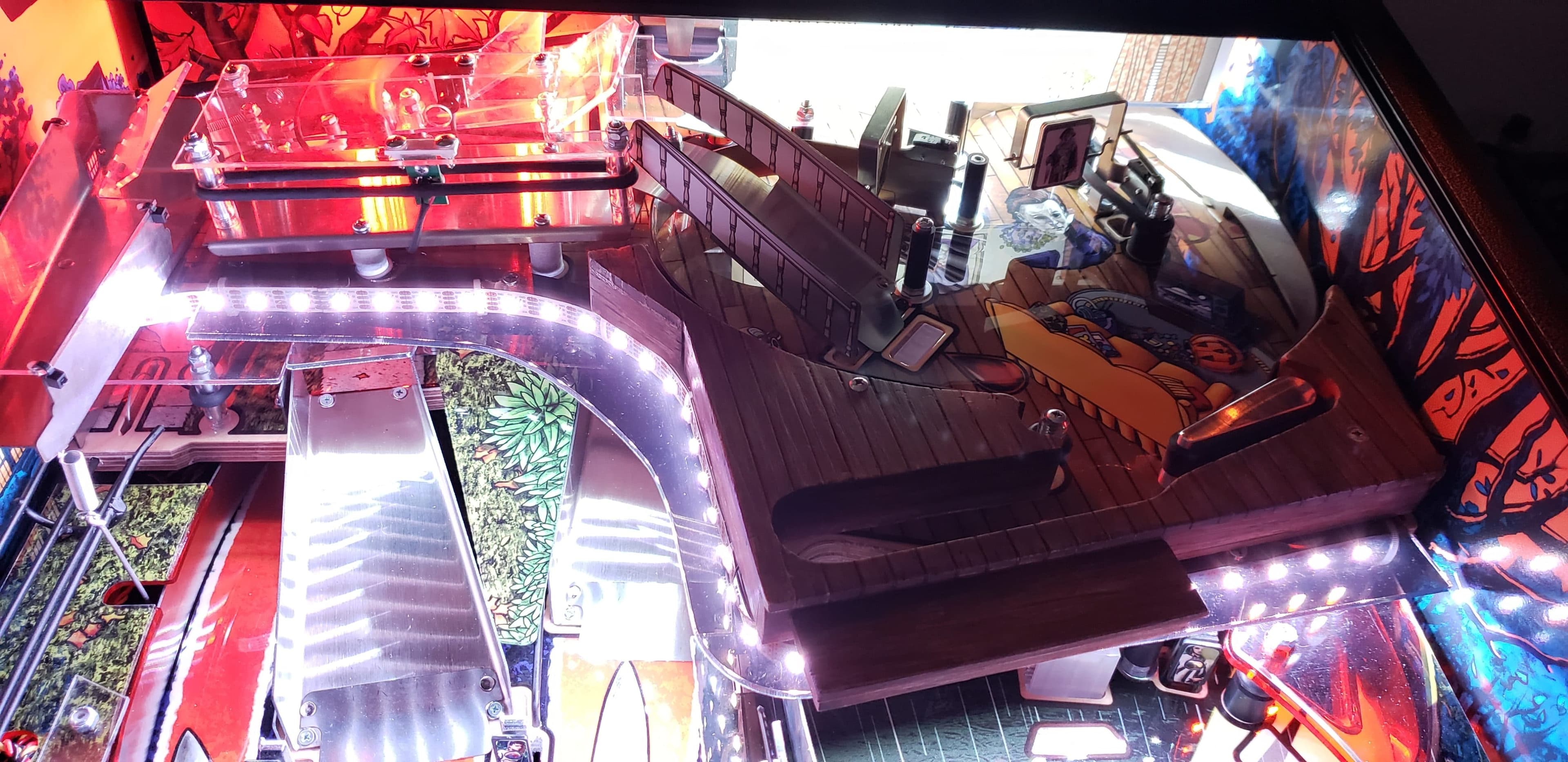 High-tech machine with LED lights and curved metallic conveyor system