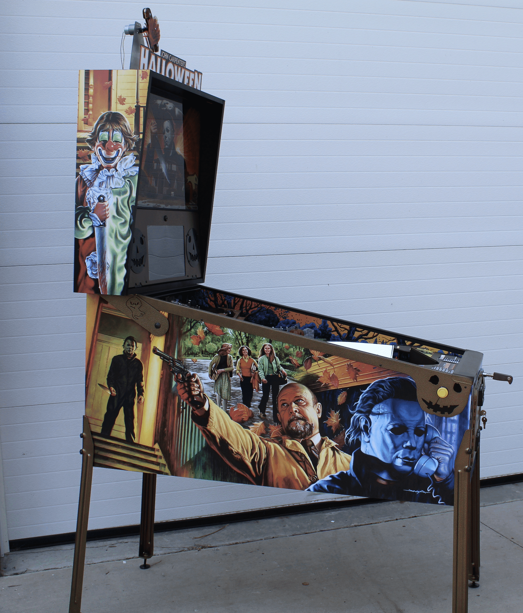 Halloween themed pinball machine with horror movie characters and scenes