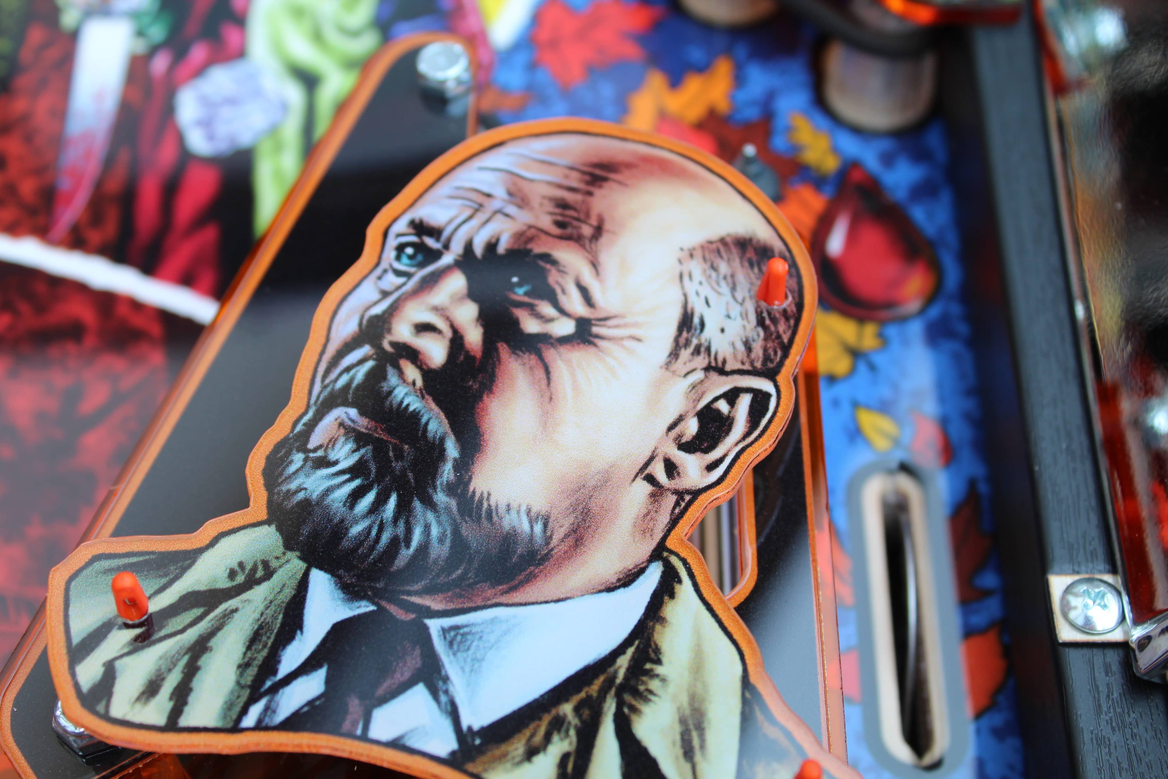 Artistic portrait of an intense, older man with dramatic shading and orange border