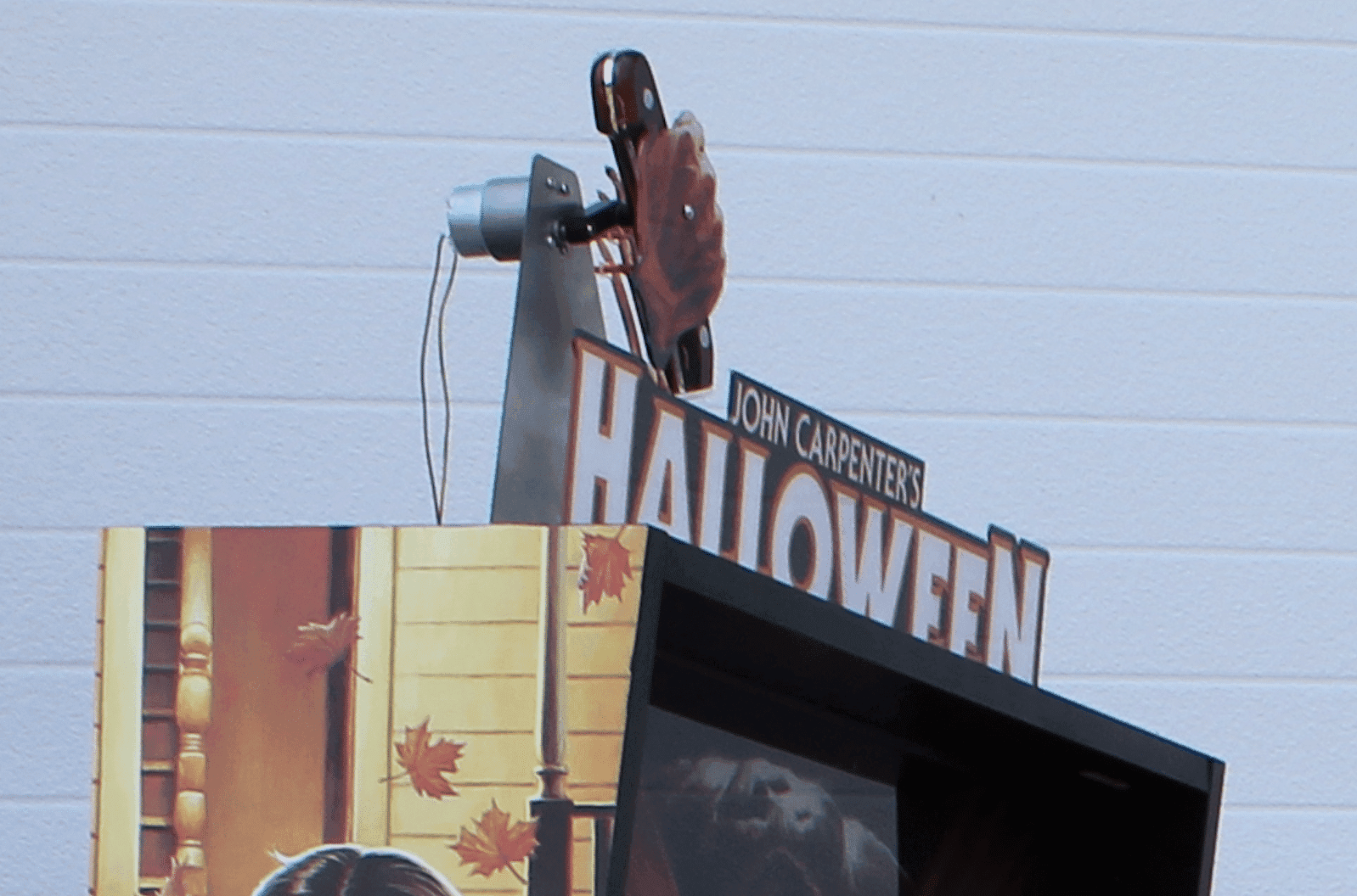 John Carpenter's Halloween movie poster with camera and autumn leaves