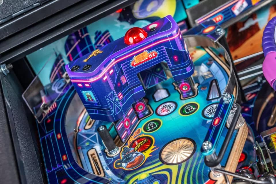 Colorful retro pinball machine with vibrant blue and purple design