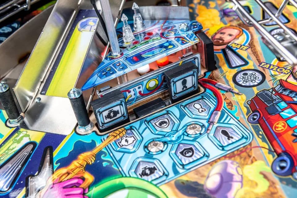 Colorful pinball machine with detailed blue control panel and vibrant artwork