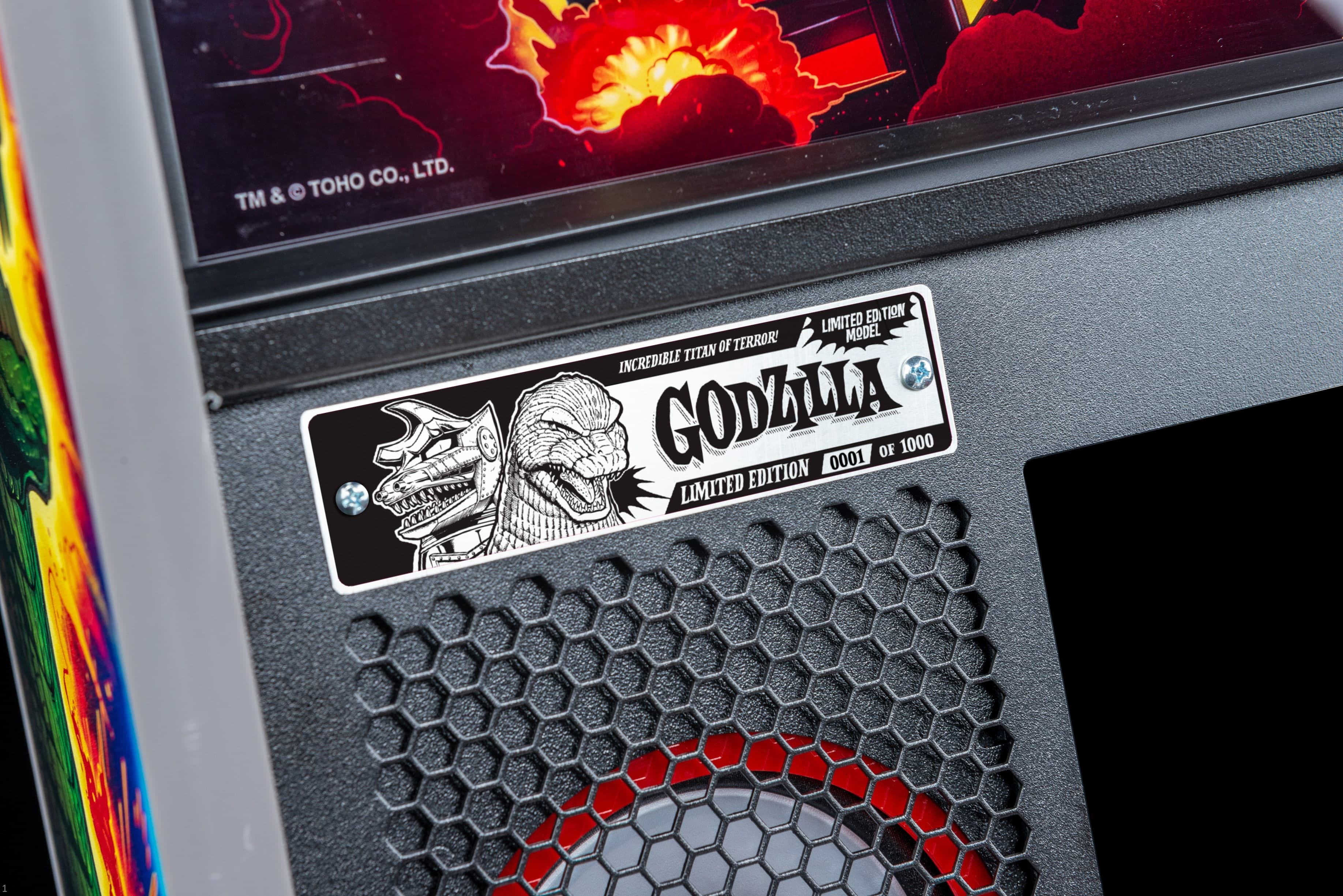 Limited edition Godzilla label on device with explosive background