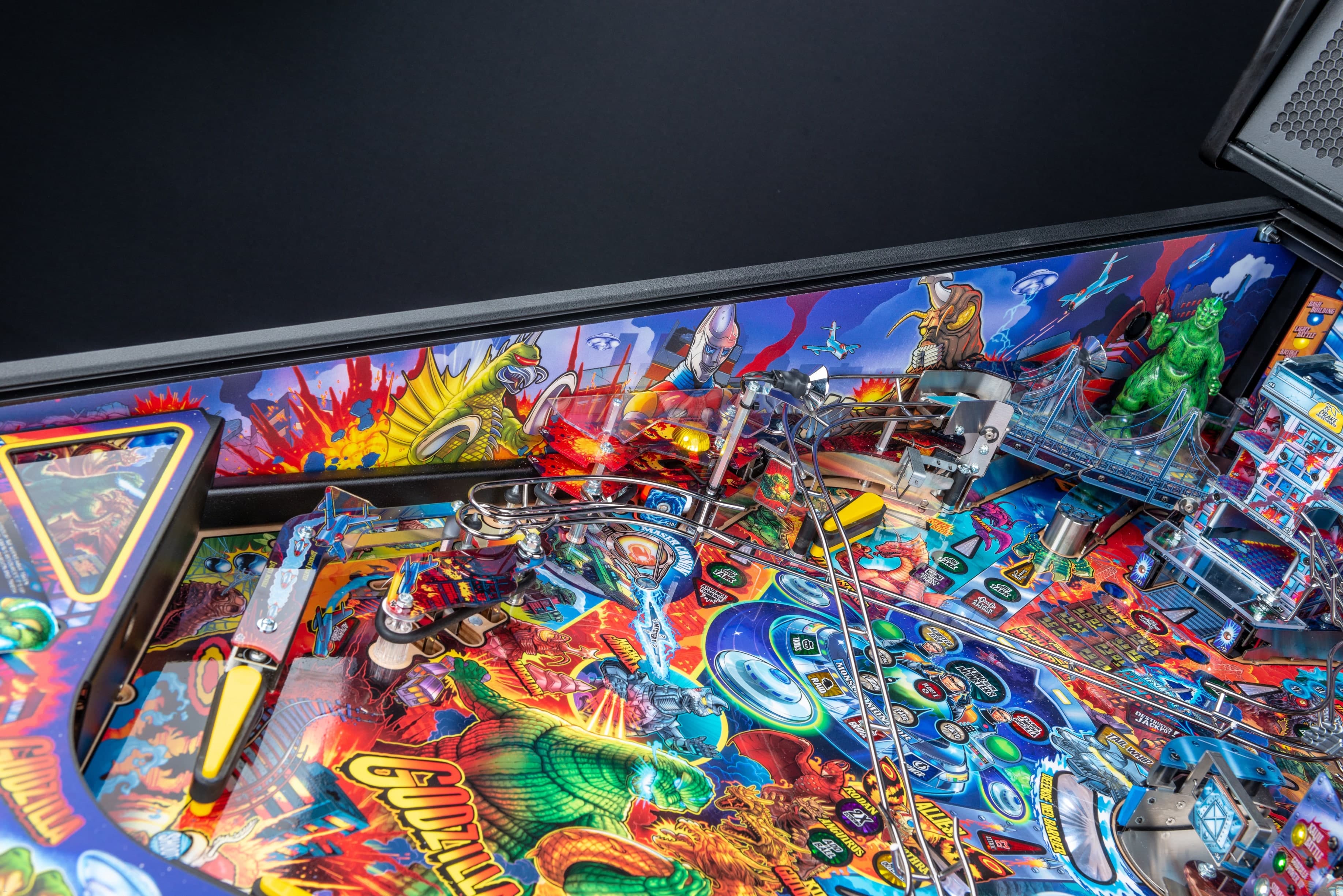 Colorful pinball machine with monsters, explosions, and intricate playfield design