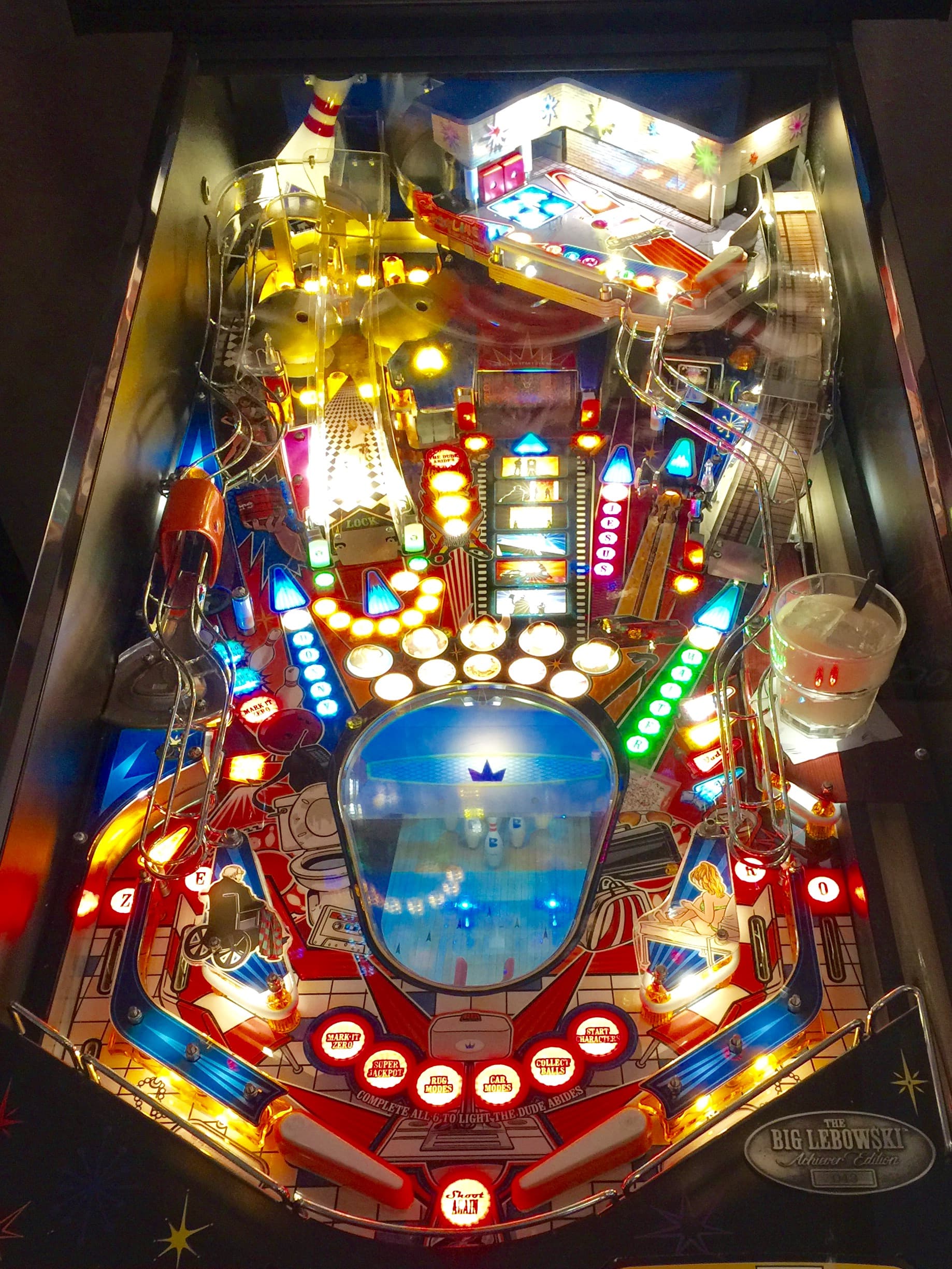 Colorful and brightly lit pinball machine based on The Big Lebowski movie